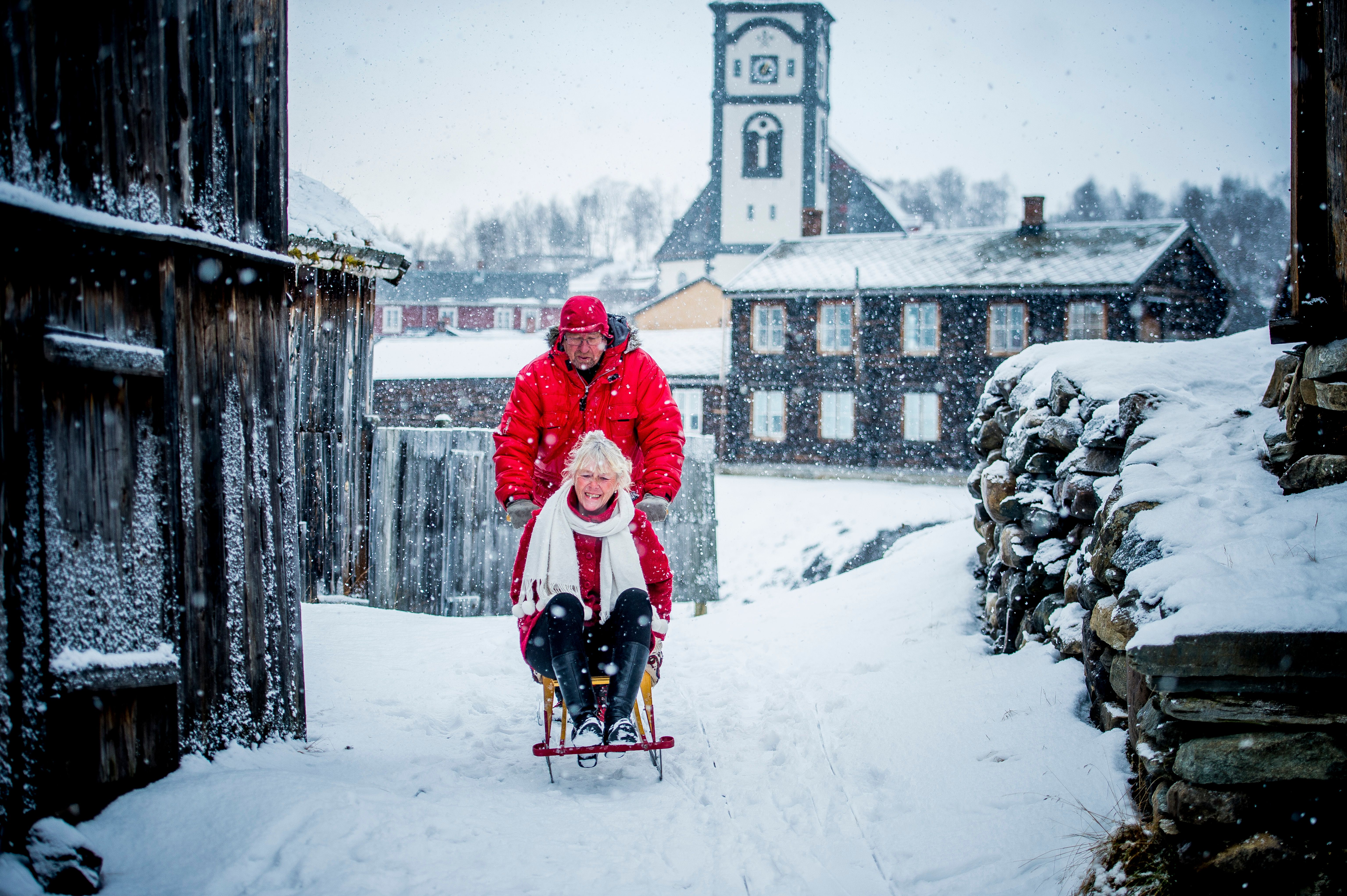 A couple at kicksledding at Røros in Trøndelag, Norway.