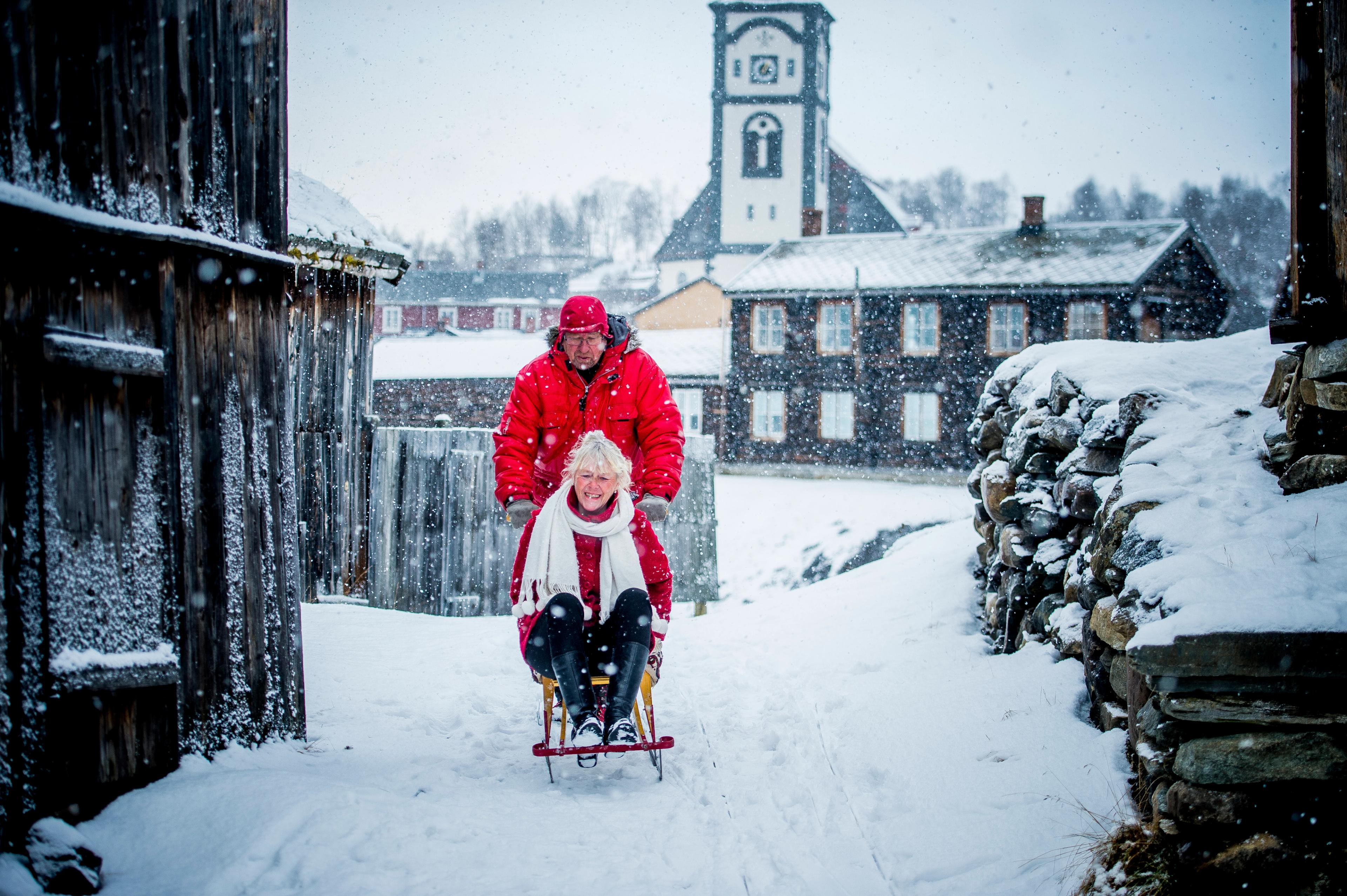 A couple at kicksledding at Røros in Trøndelag, Norway.