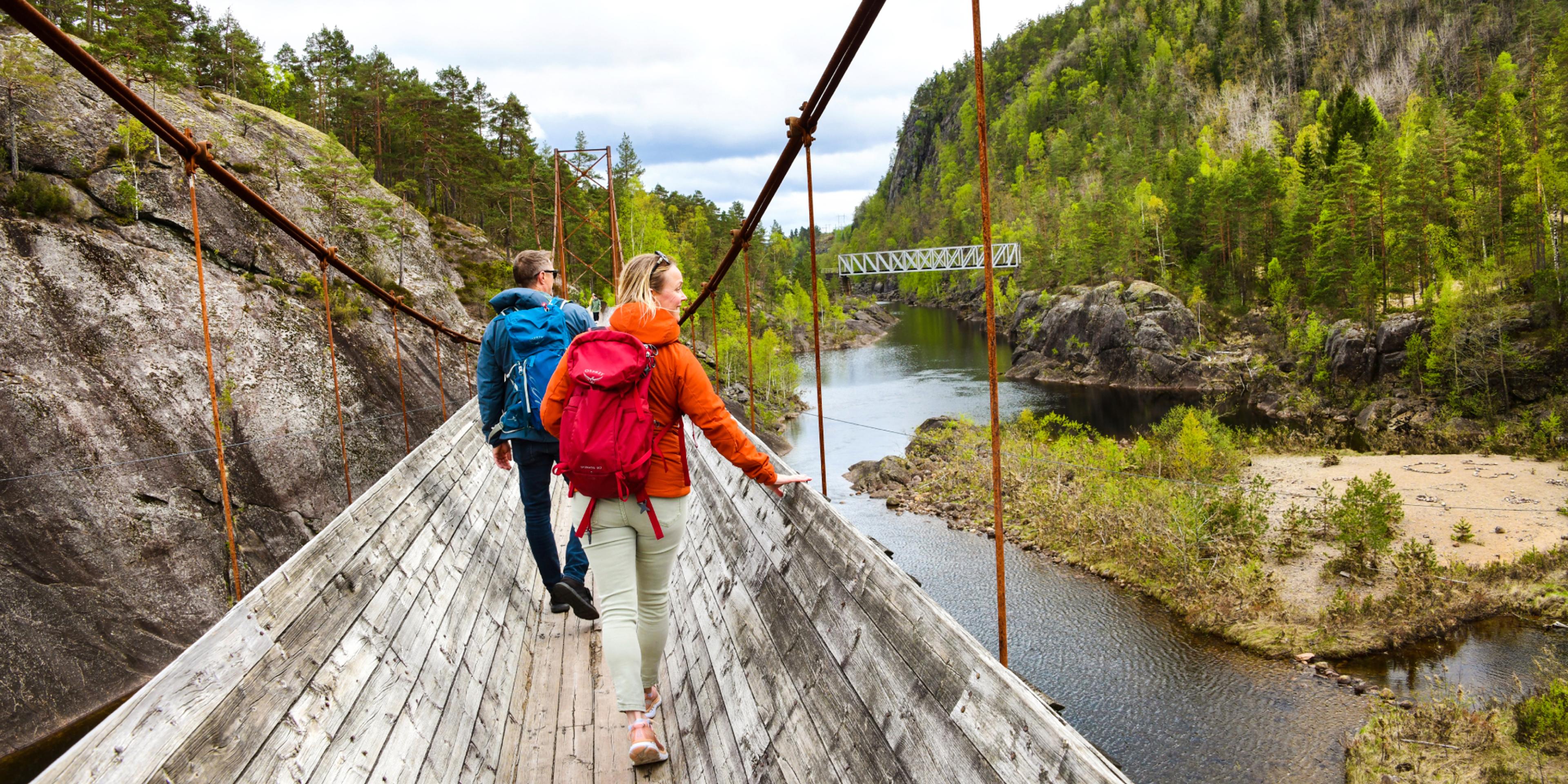 Two people hiking the Tømmerrenna timber slide in Vennesla, Southern Norway