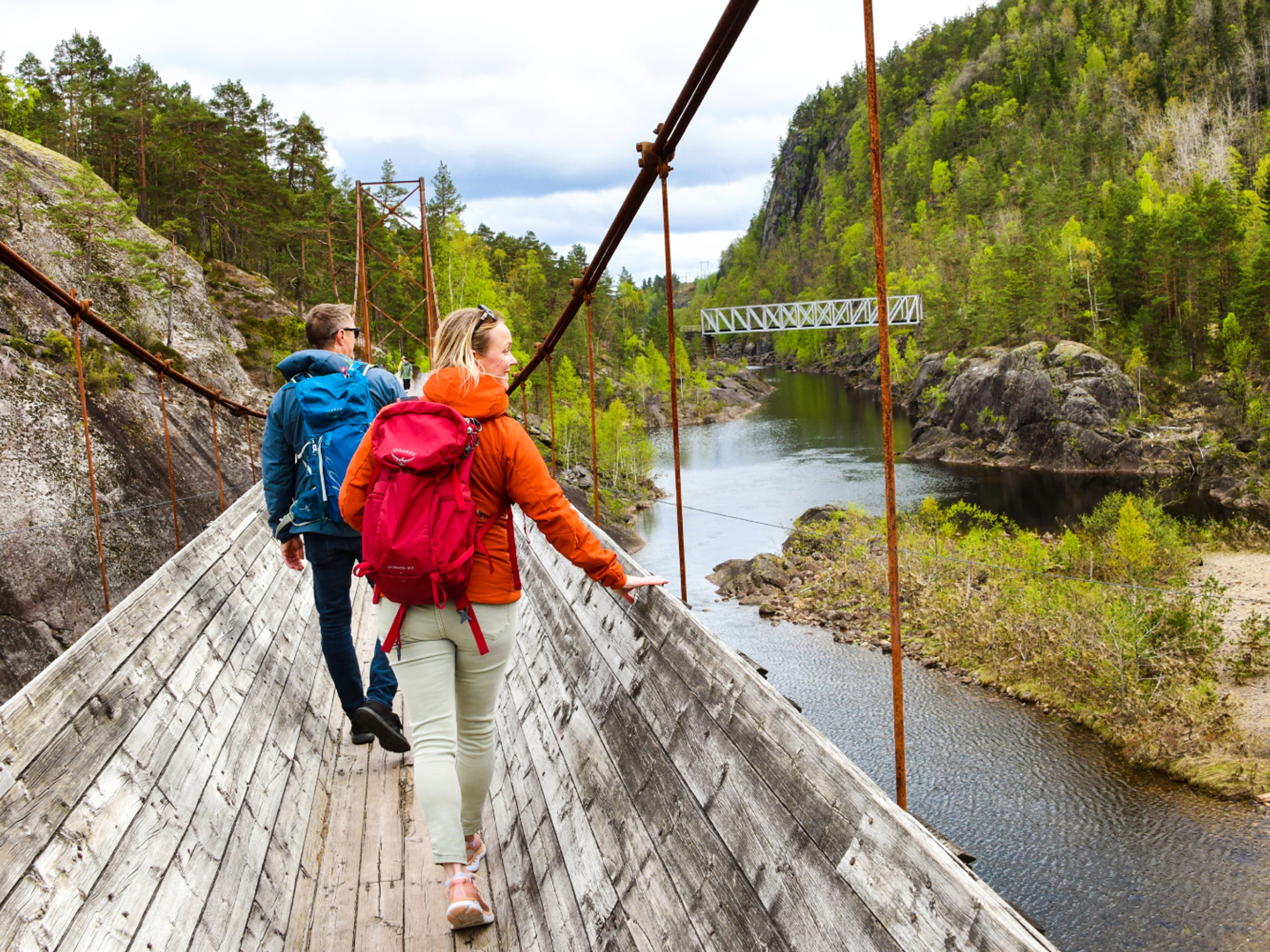 Two people hiking the Tømmerrenna timber slide in Vennesla, Southern Norway