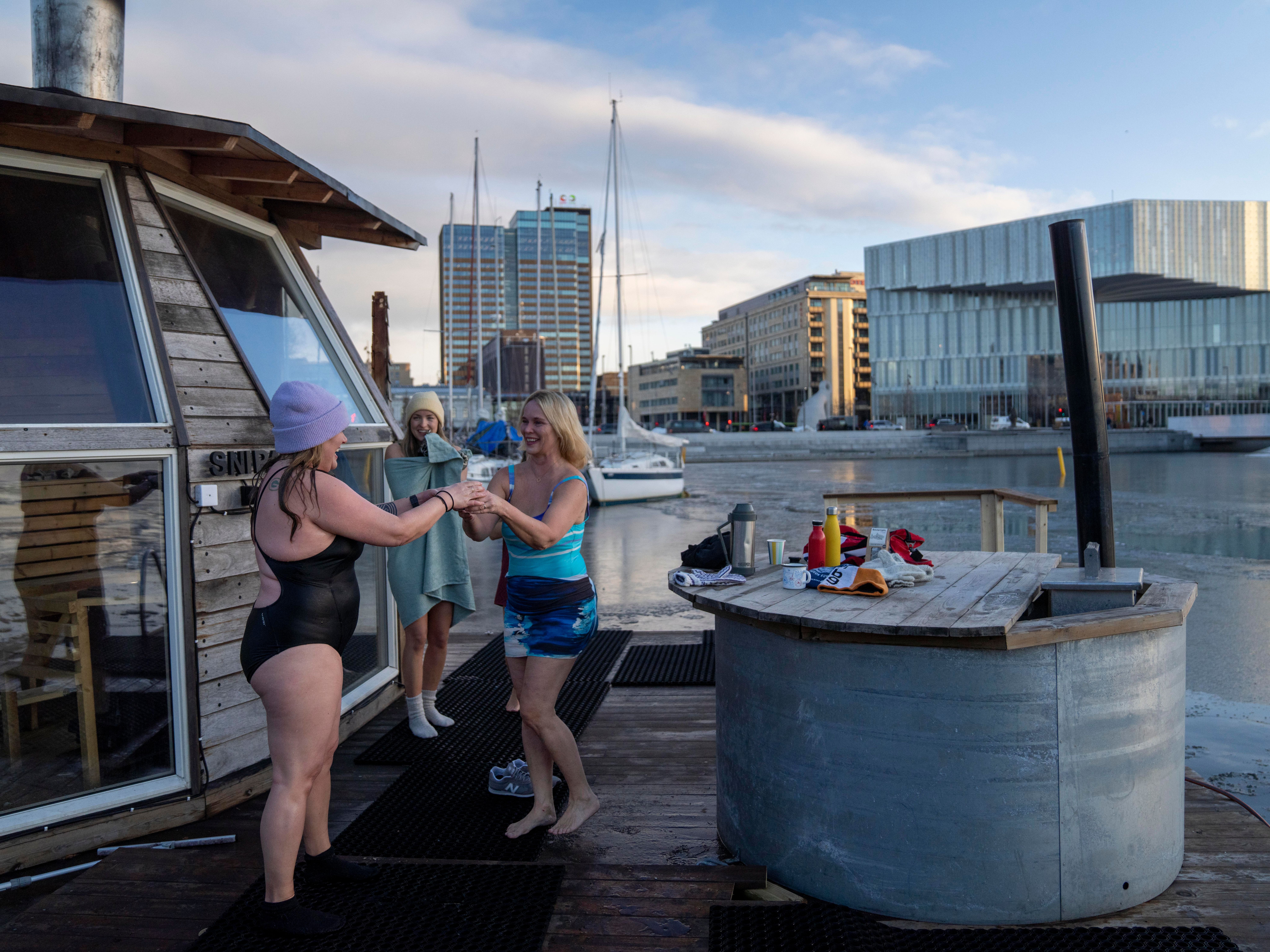 Friends drinking hot tea after ice bathing in Oslo, Eastern norway