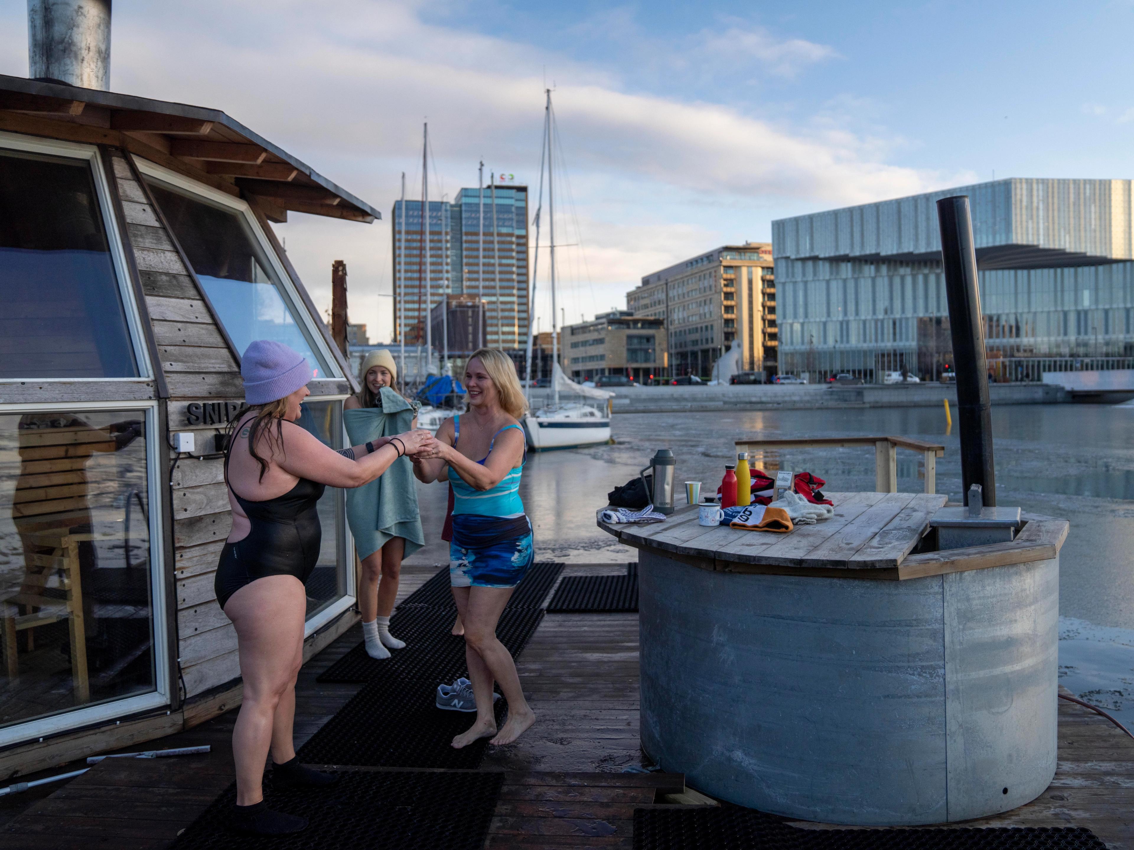 Friends drinking hot tea after ice bathing in Oslo, Eastern norway