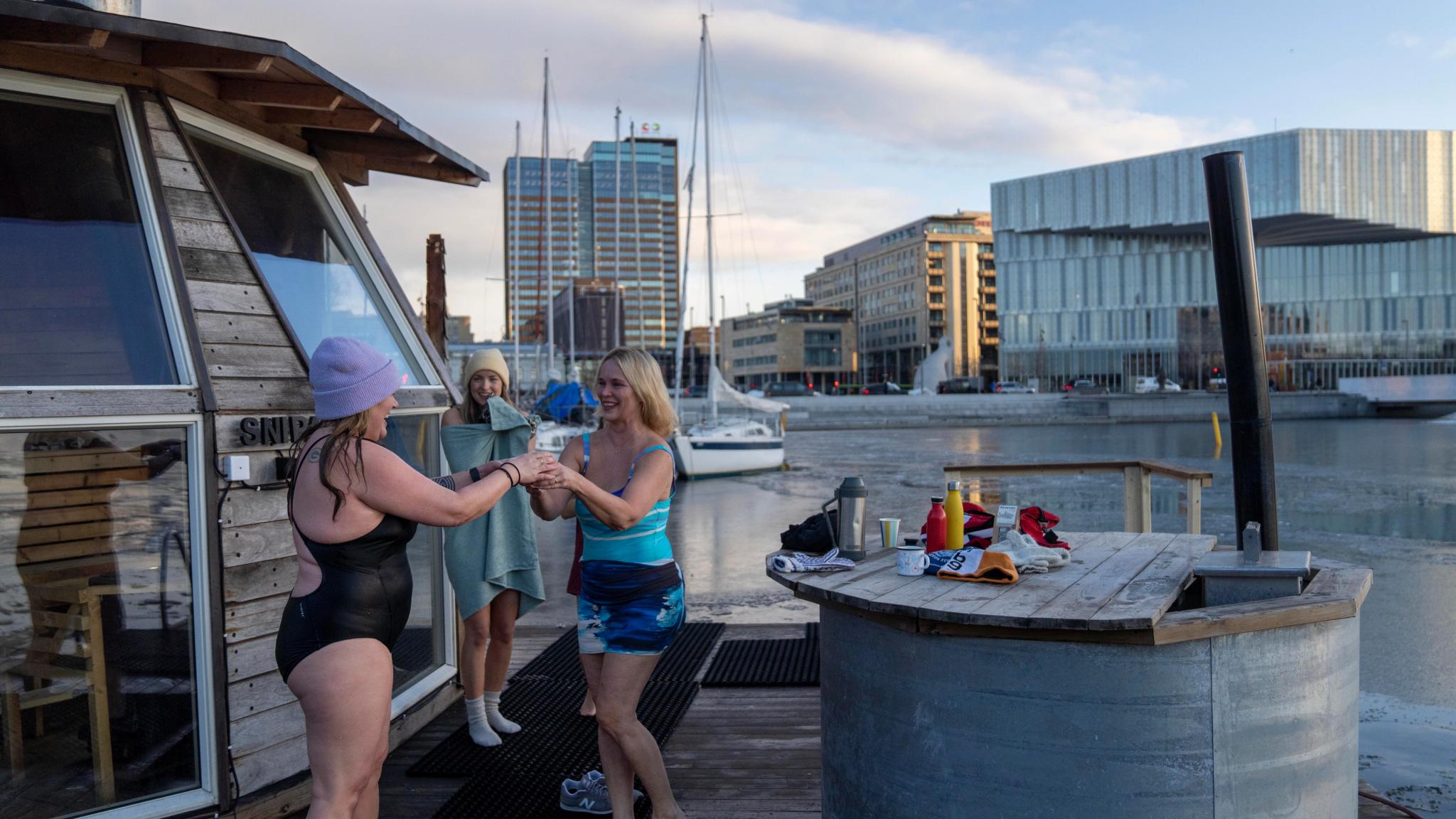 Friends drinking hot tea after ice bathing in Oslo, Eastern norway