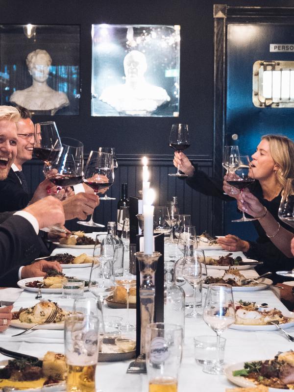 Friends eating a nice dinner at Louise Bar and Restaurant in Oslo