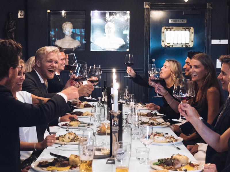 Friends eating a nice dinner at Louise Bar and Restaurant in Oslo