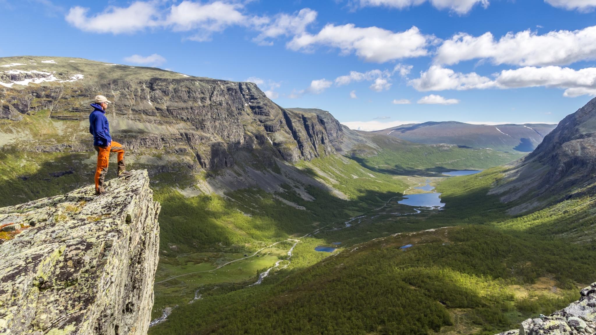 A person hiking in the Hydalen valley near Hemsedal in Eastern Norway