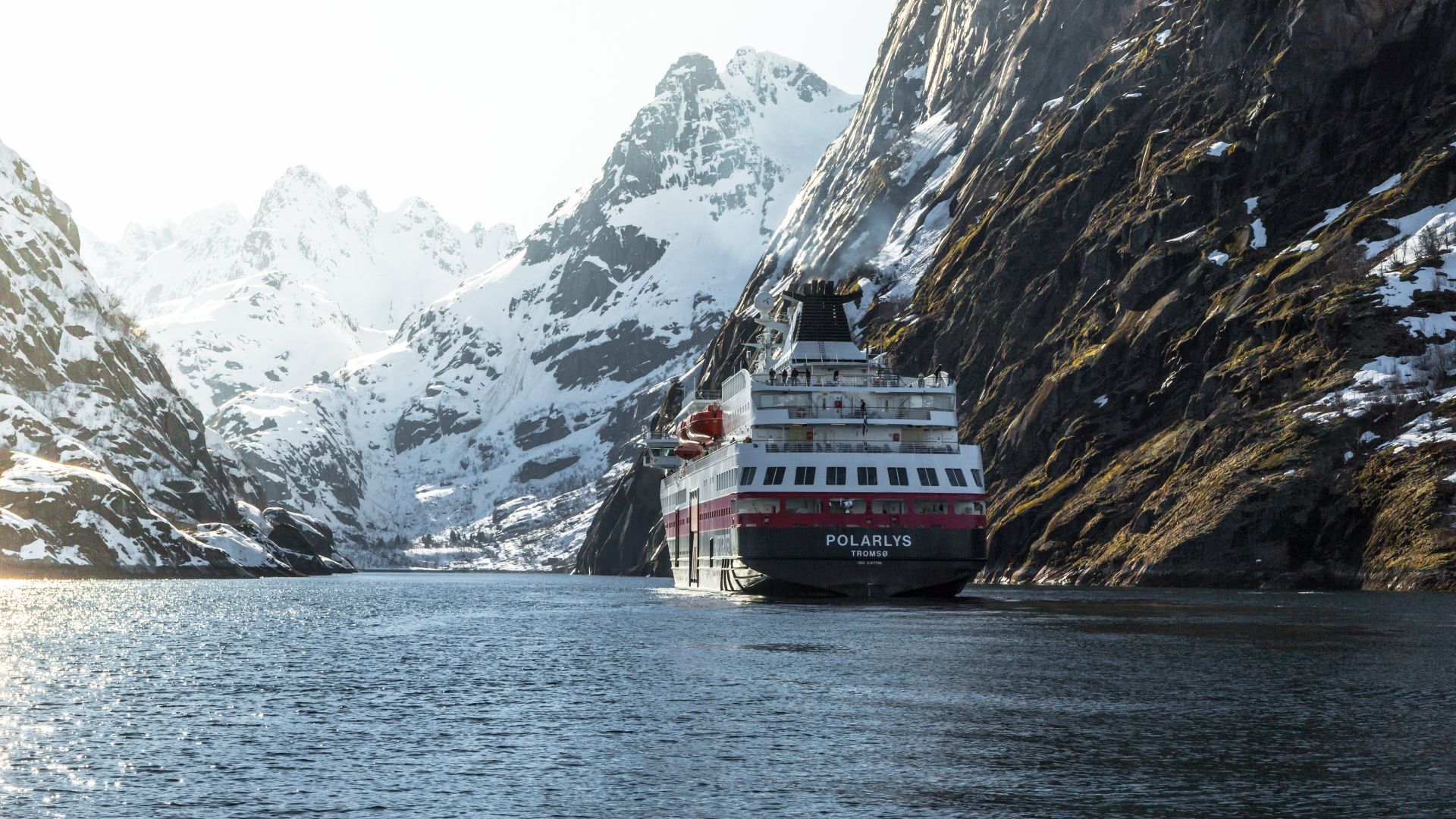 Hurtigruten between steep mountains