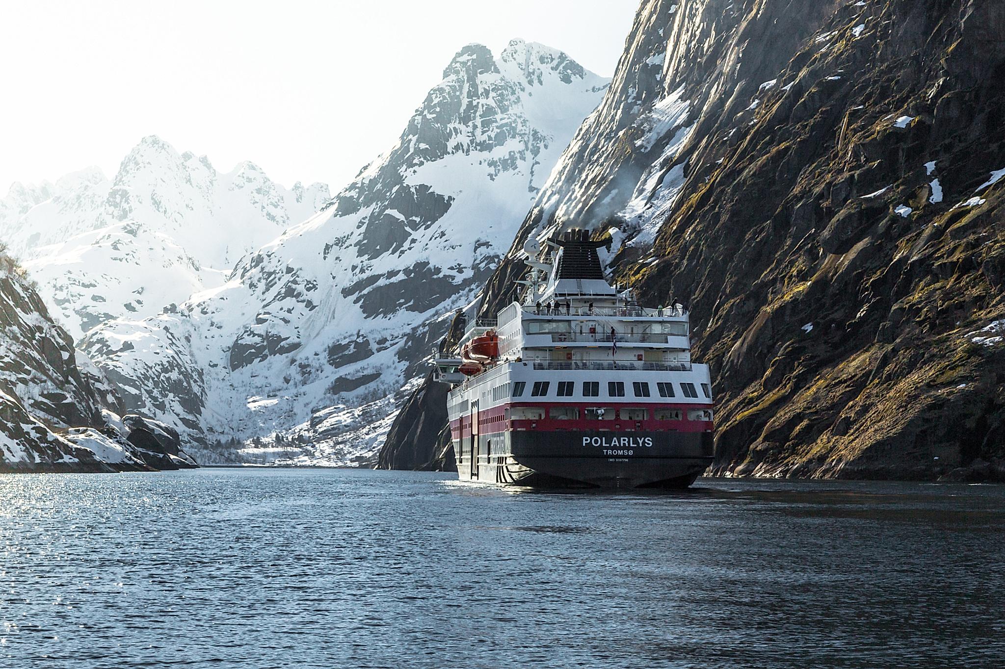 Hurtigruten between steep mountains