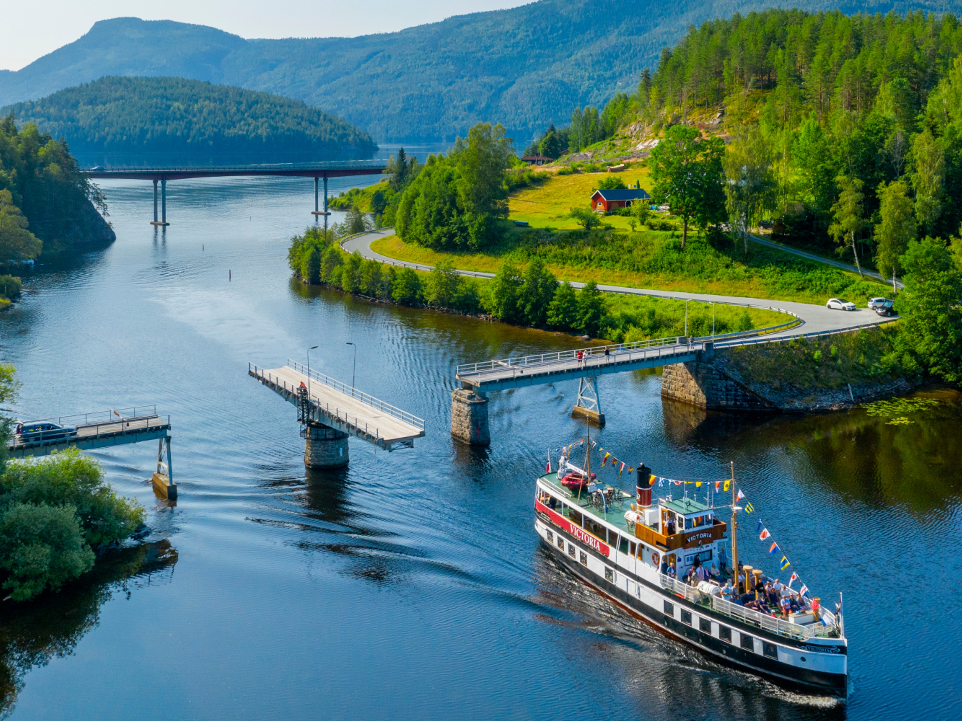 M/S Victoria passing Sundkil Bridge in Telemark, Norway