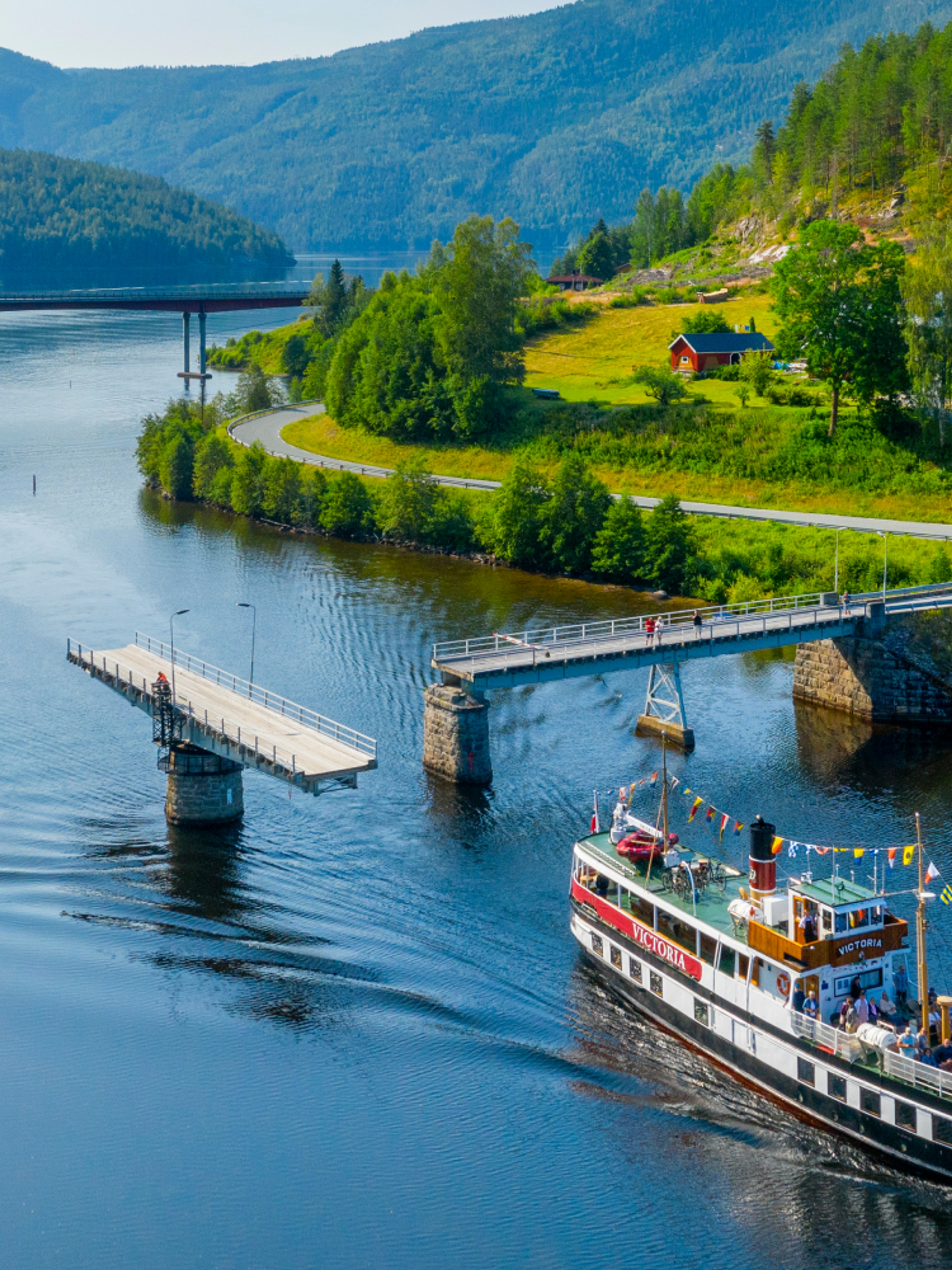 M/S Victoria passing Sundkil Bridge in Telemark, Norway