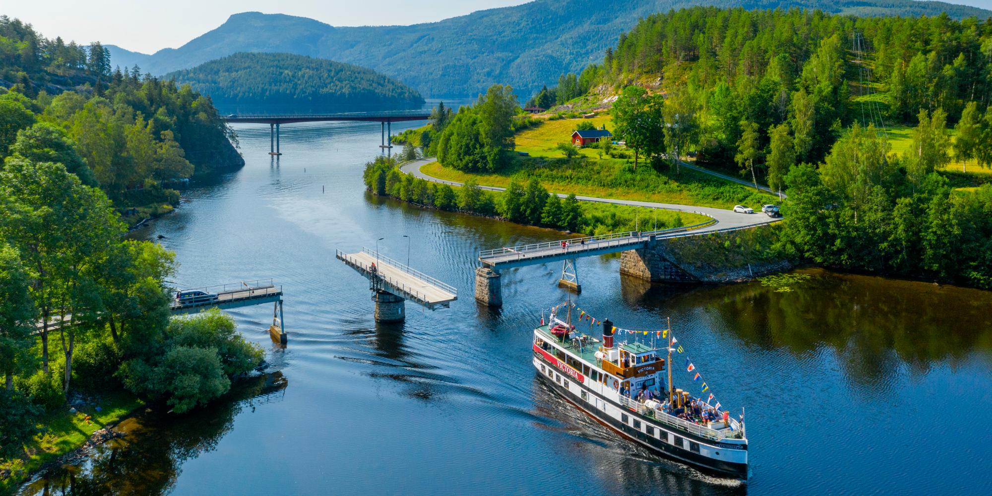 M/S Victoria passing Sundkil Bridge in Telemark, Norway