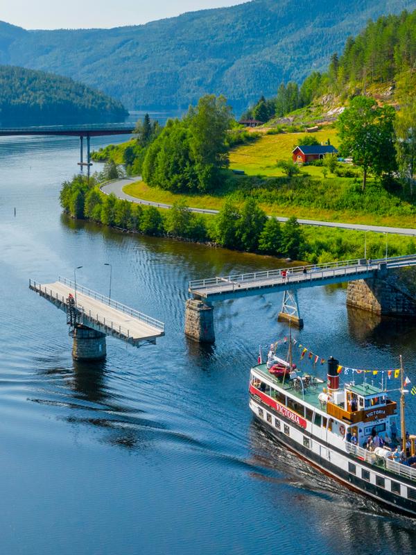 M/S Victoria passing Sundkil Bridge in Telemark, Norway