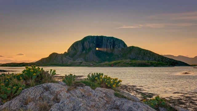 Timelapse of the sun shining through the hole in the Torghatten mountain in Helgeland, Northern Norway