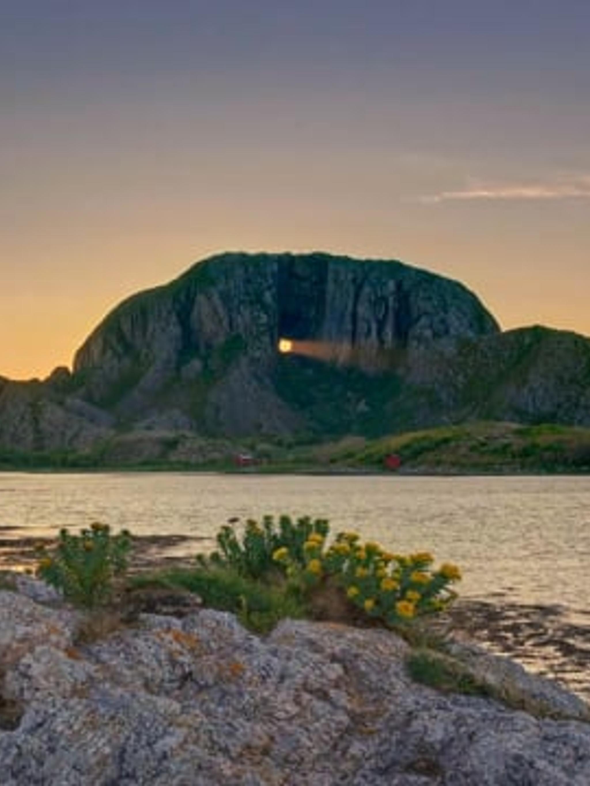 Timelapse of the sun shining through the hole in the Torghatten mountain in Helgeland, Northern Norway