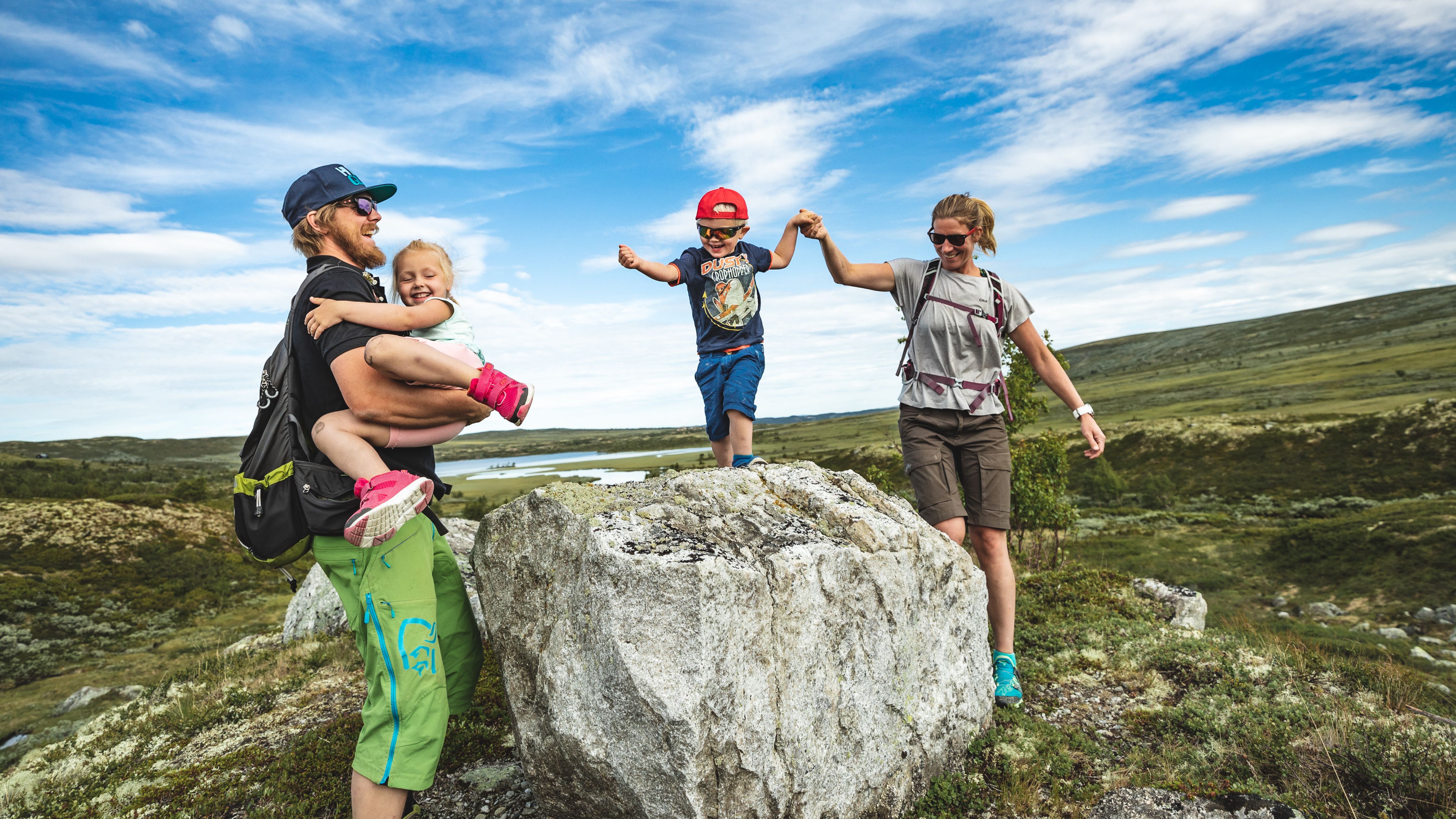 Family of four hiking and playing at Prestholtseter in Geilo, Eastern Norway