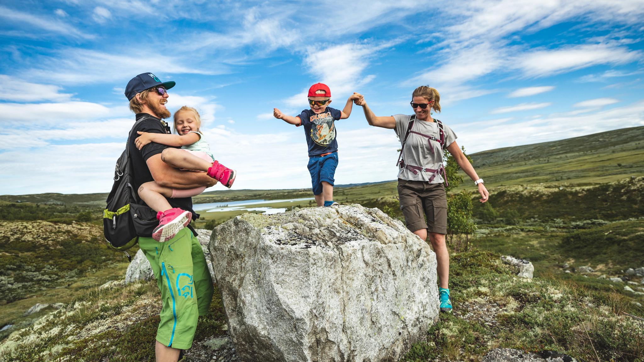 Family of four hiking and playing at Prestholtseter in Geilo, Eastern Norway
