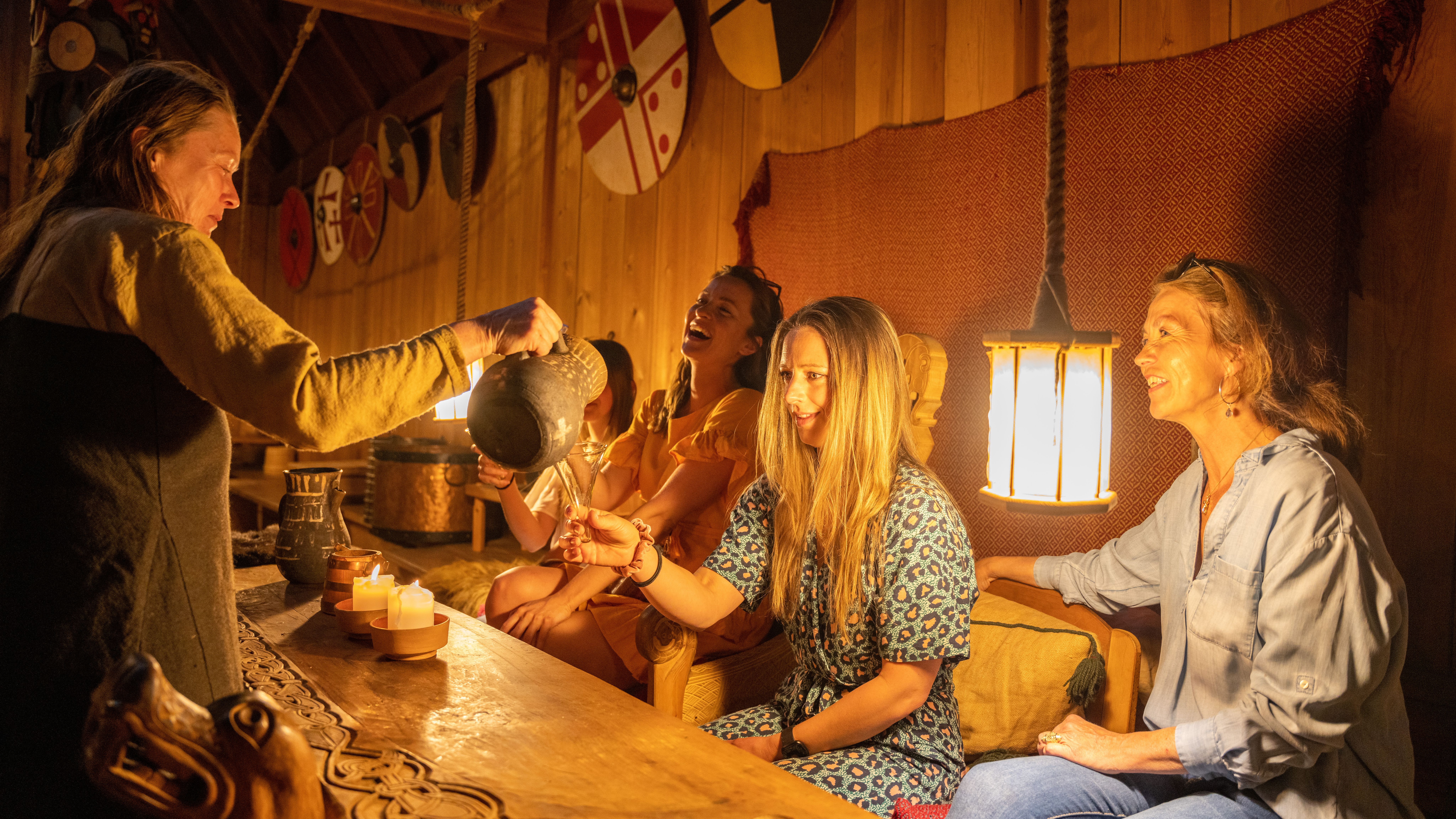 A group of people visiting the Midgard Viking center at Borre, in Vestfold
