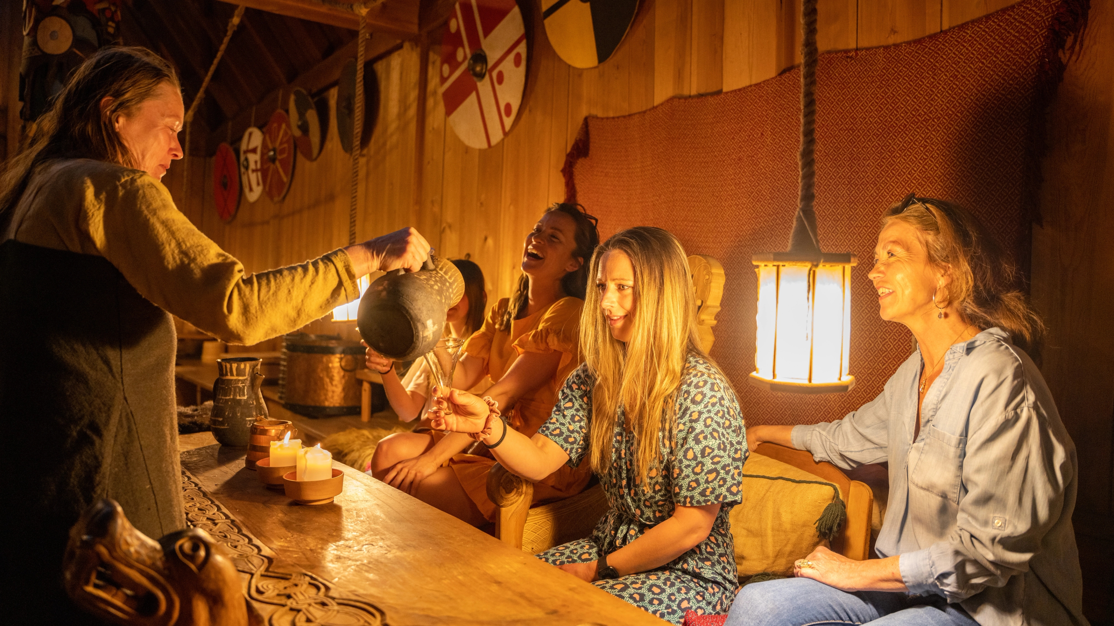 A group of people visiting the Midgard Viking center at Borre, in Vestfold
