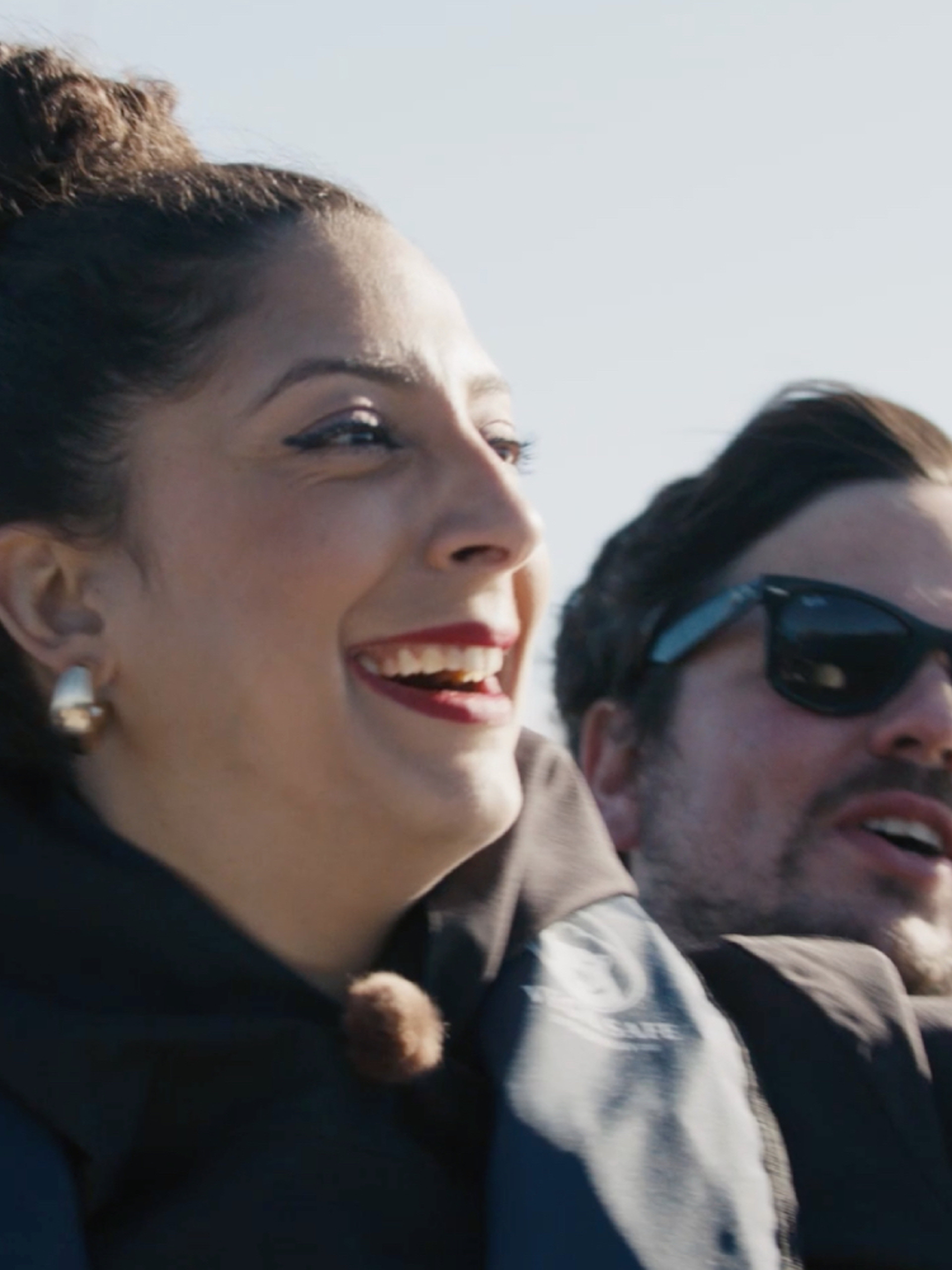 Couple standing on a boat.