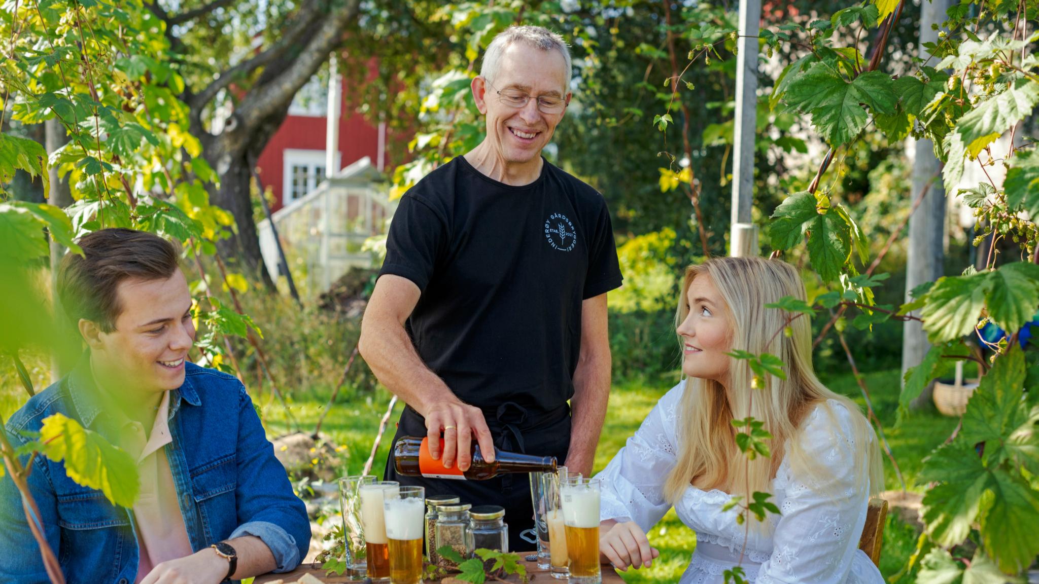 Two people being served local food on a summer day at Inderøy, Trøndelag