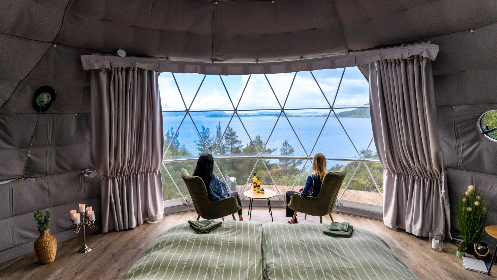 Friends enjoying a stay at a dome at Tveita in Suldal, Ryfylke, Fjord Norway.