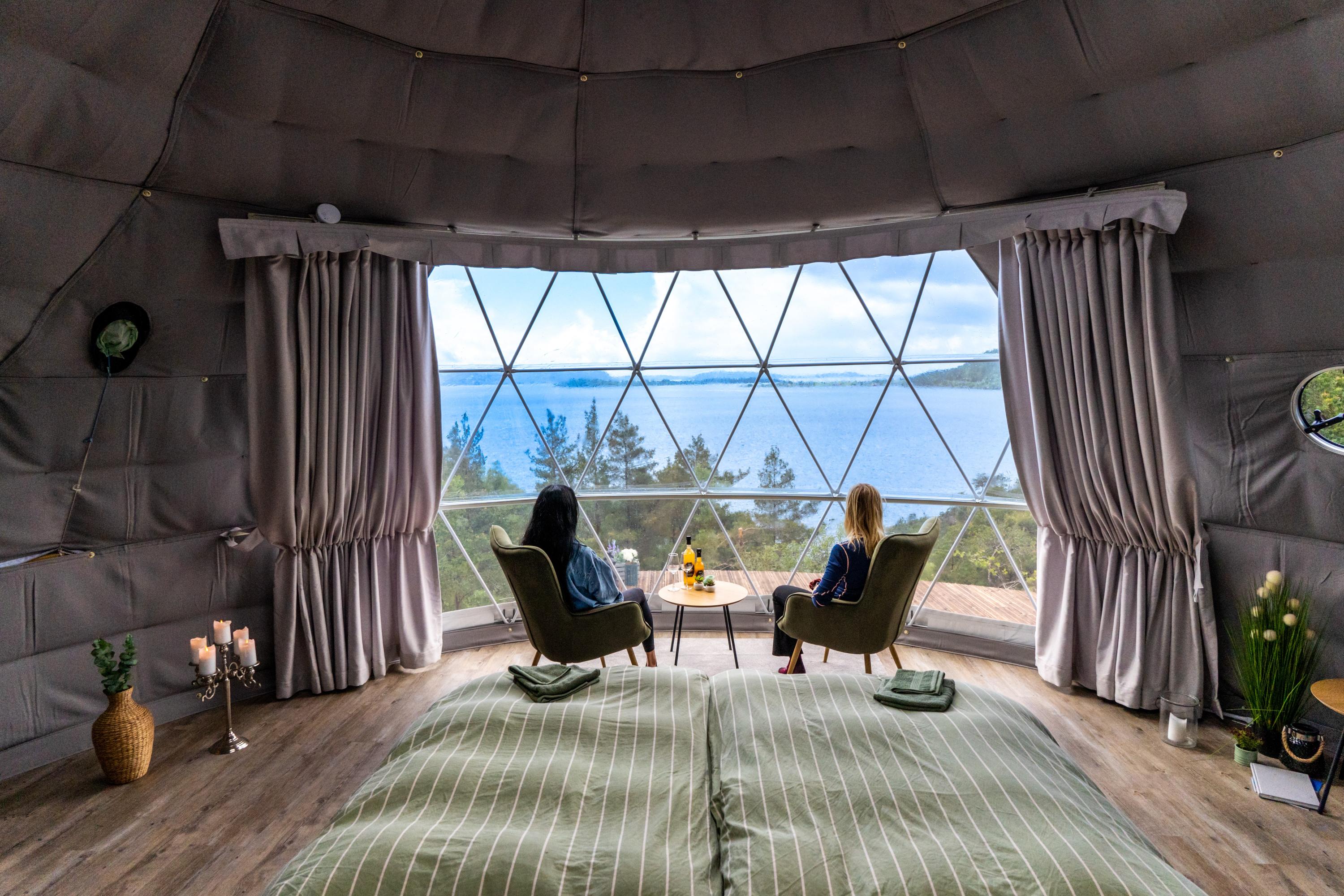 Friends enjoying a stay at a dome at Tveita in Suldal, Ryfylke, Fjord Norway.