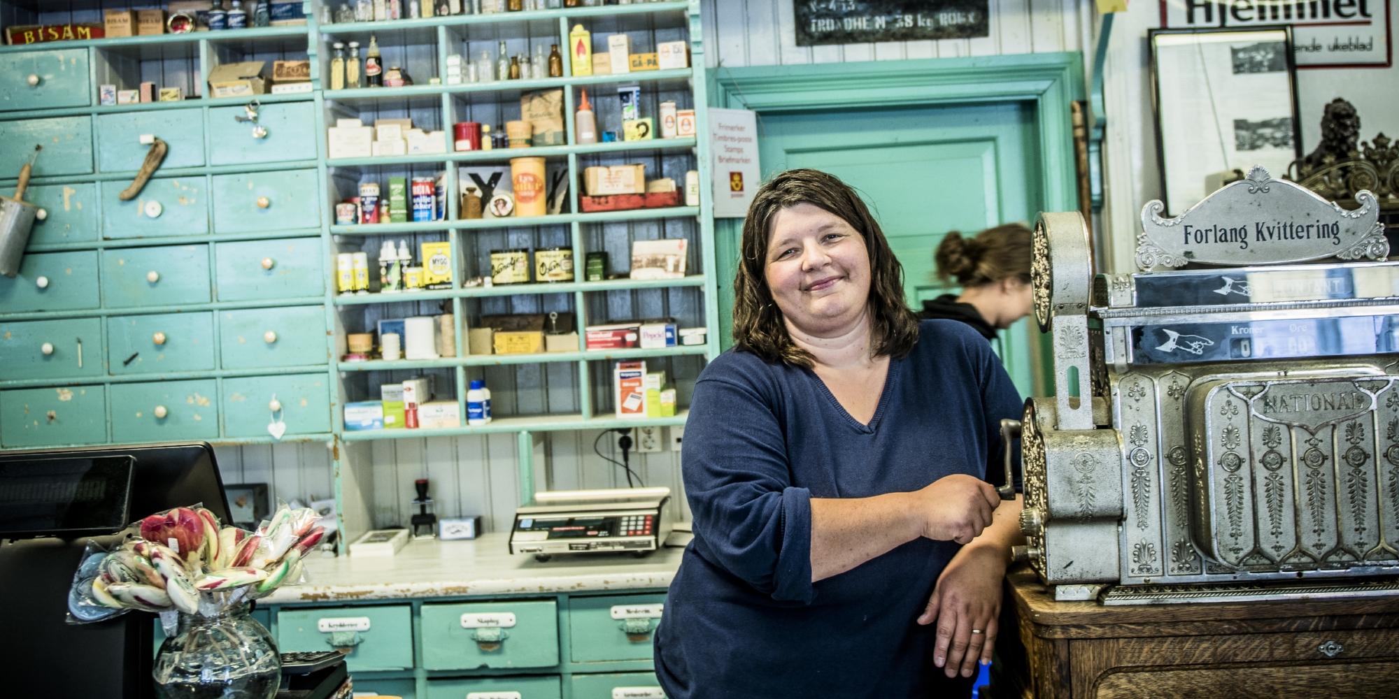 Renate Johansen, Operations Manager of Nusfjord in Lofoten, inside a grocery store that looks the same as when it opened in 1907, Northern Norway