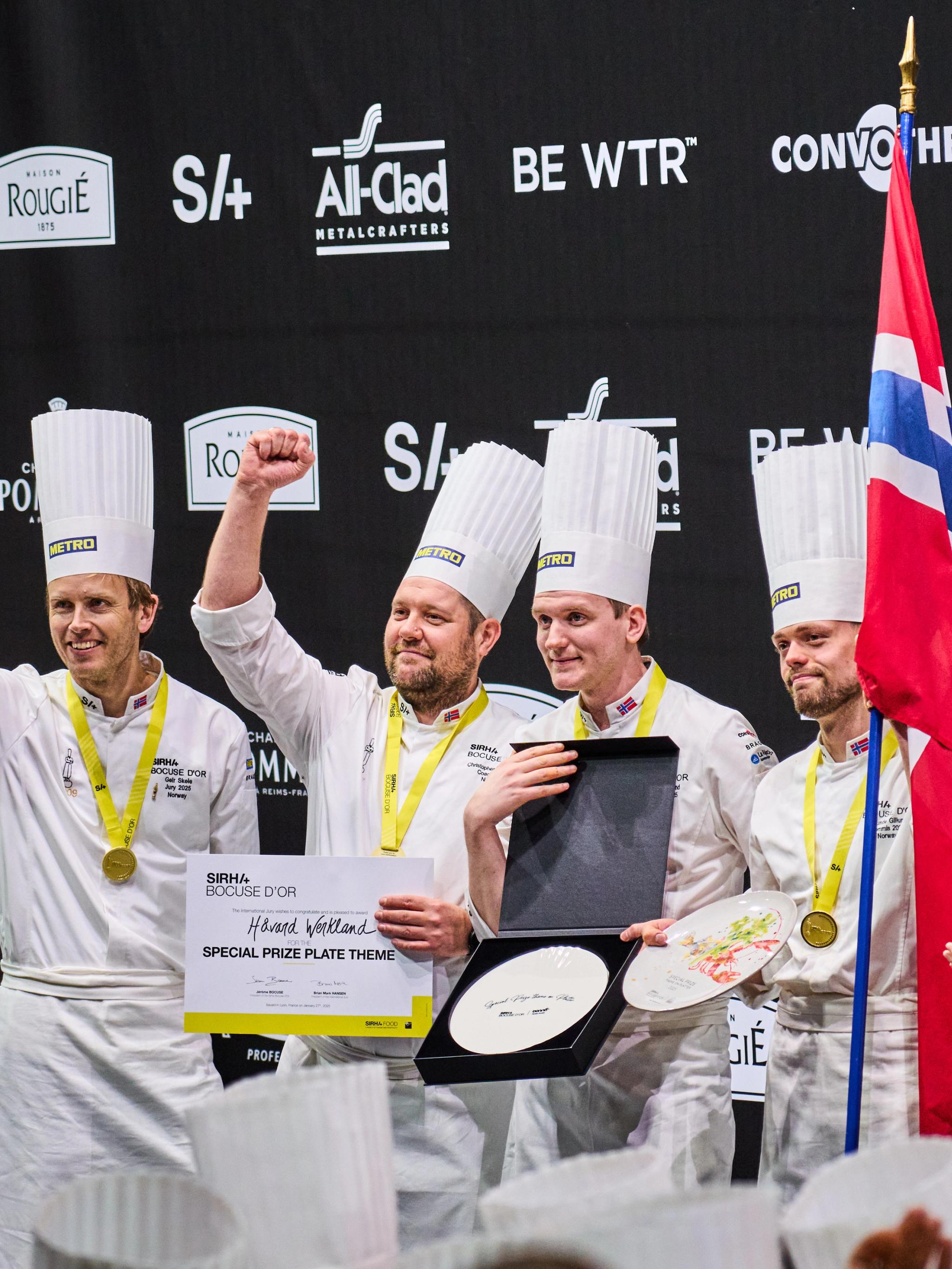 The four men that make up the Norwegian Bocuse d'Or team celebrating their award on the podium