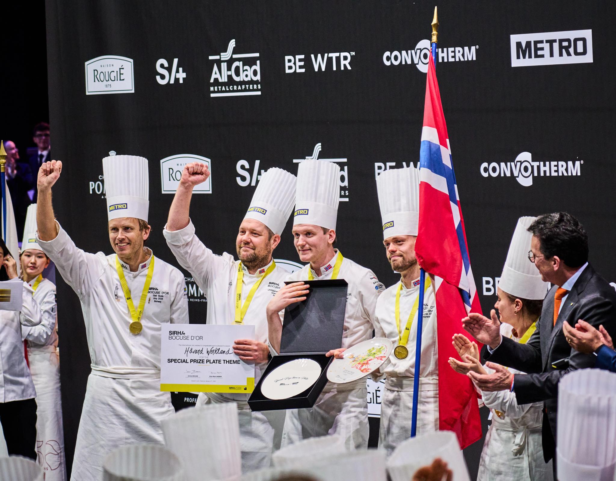The four men that make up the Norwegian Bocuse d'Or team celebrating their award on the podium