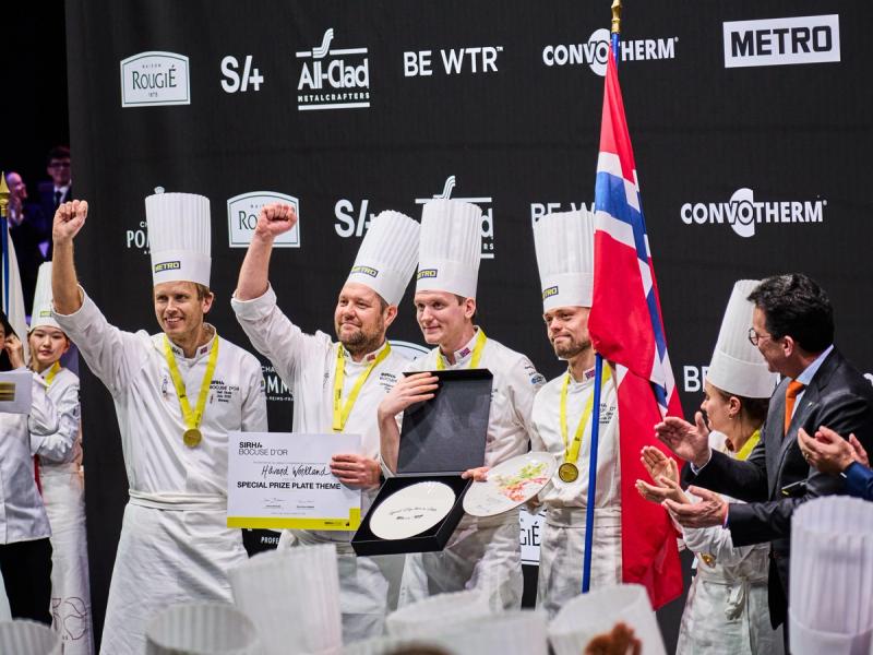 The four men that make up the Norwegian Bocuse d'Or team celebrating their award on the podium