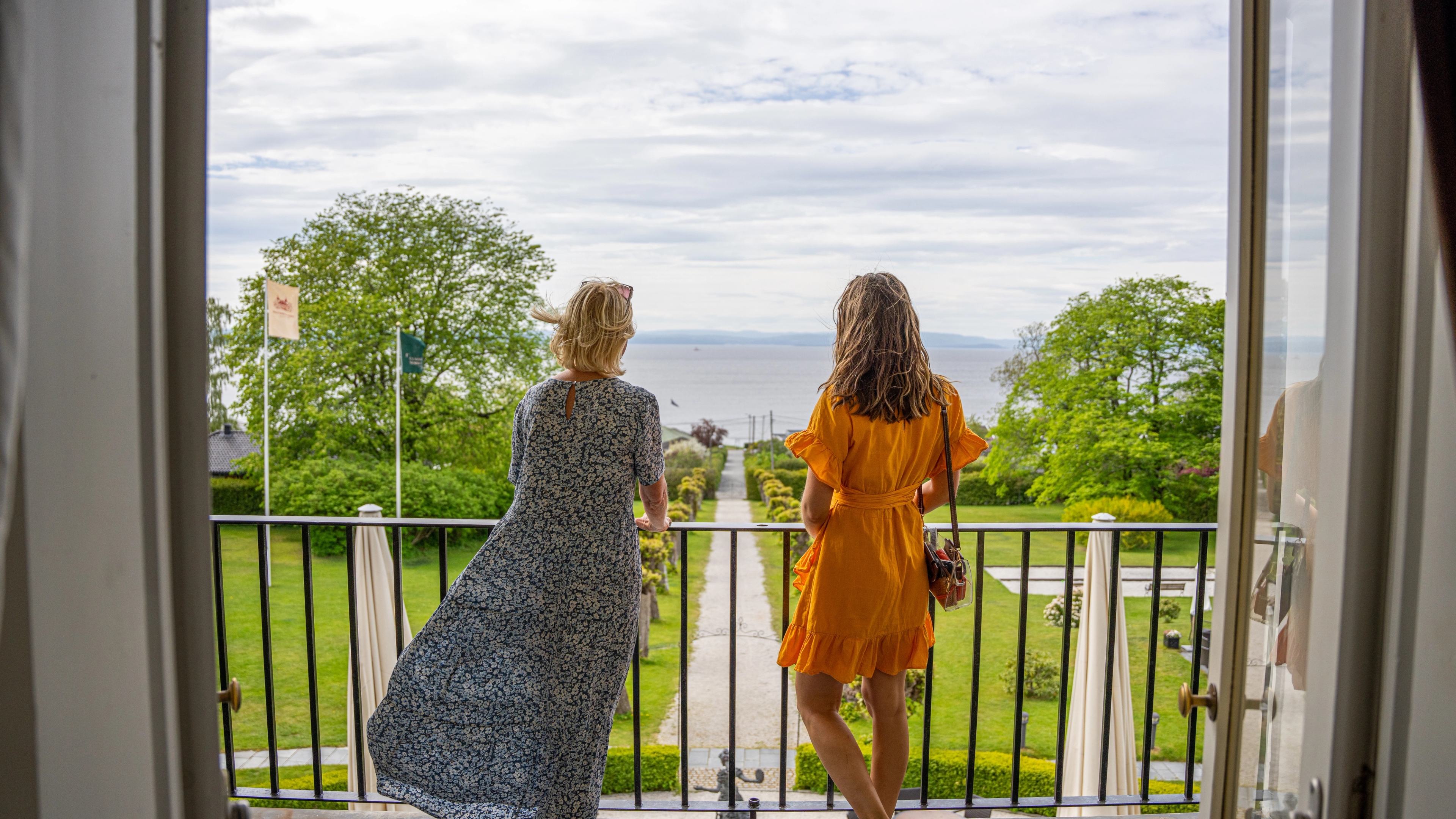 Two women enjoying the view from Refsnes Gods at the Jeløy peninsula in Moss