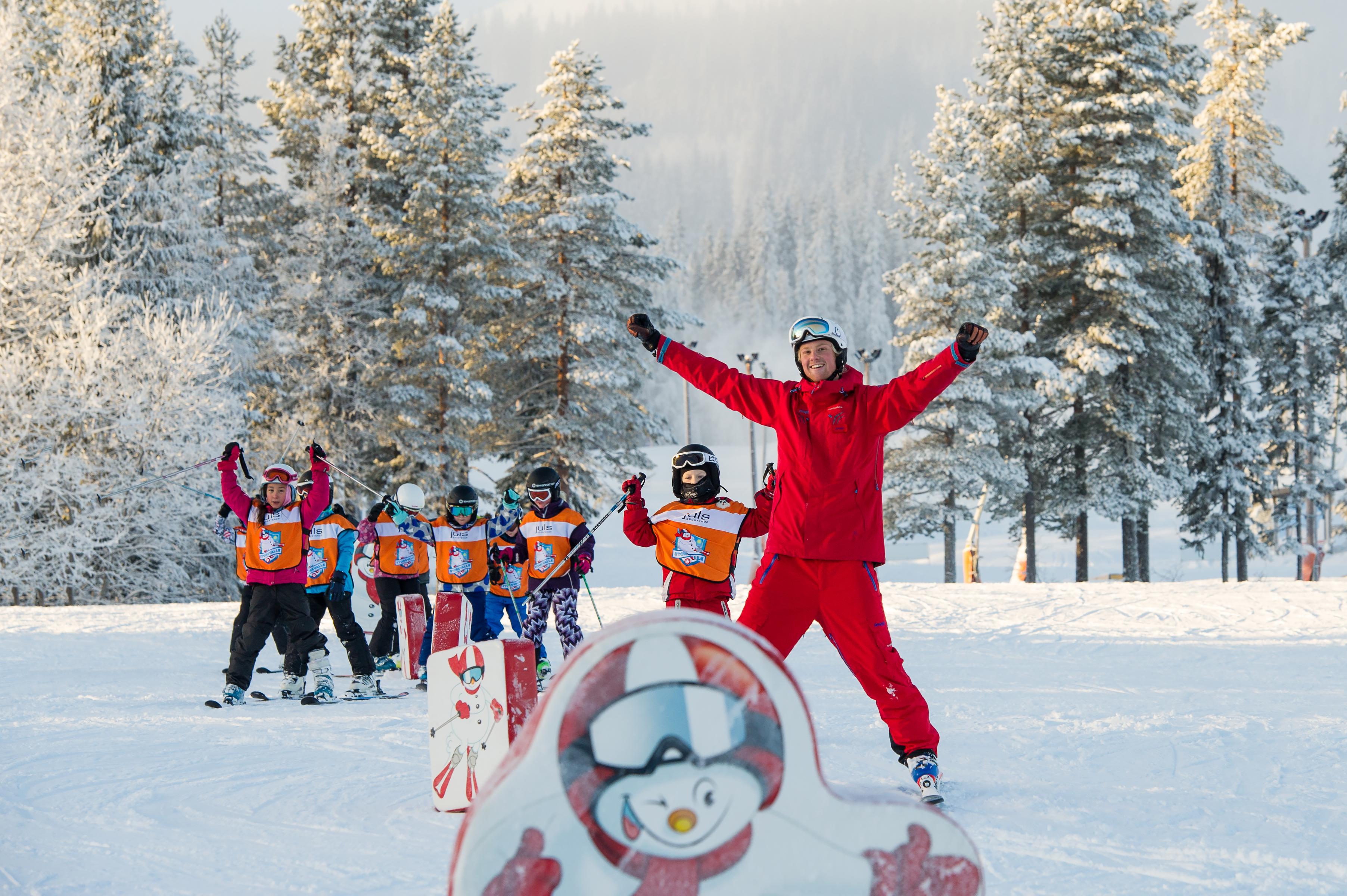 Children skiing with an instructor in Trysil ski school, Eastern Norway