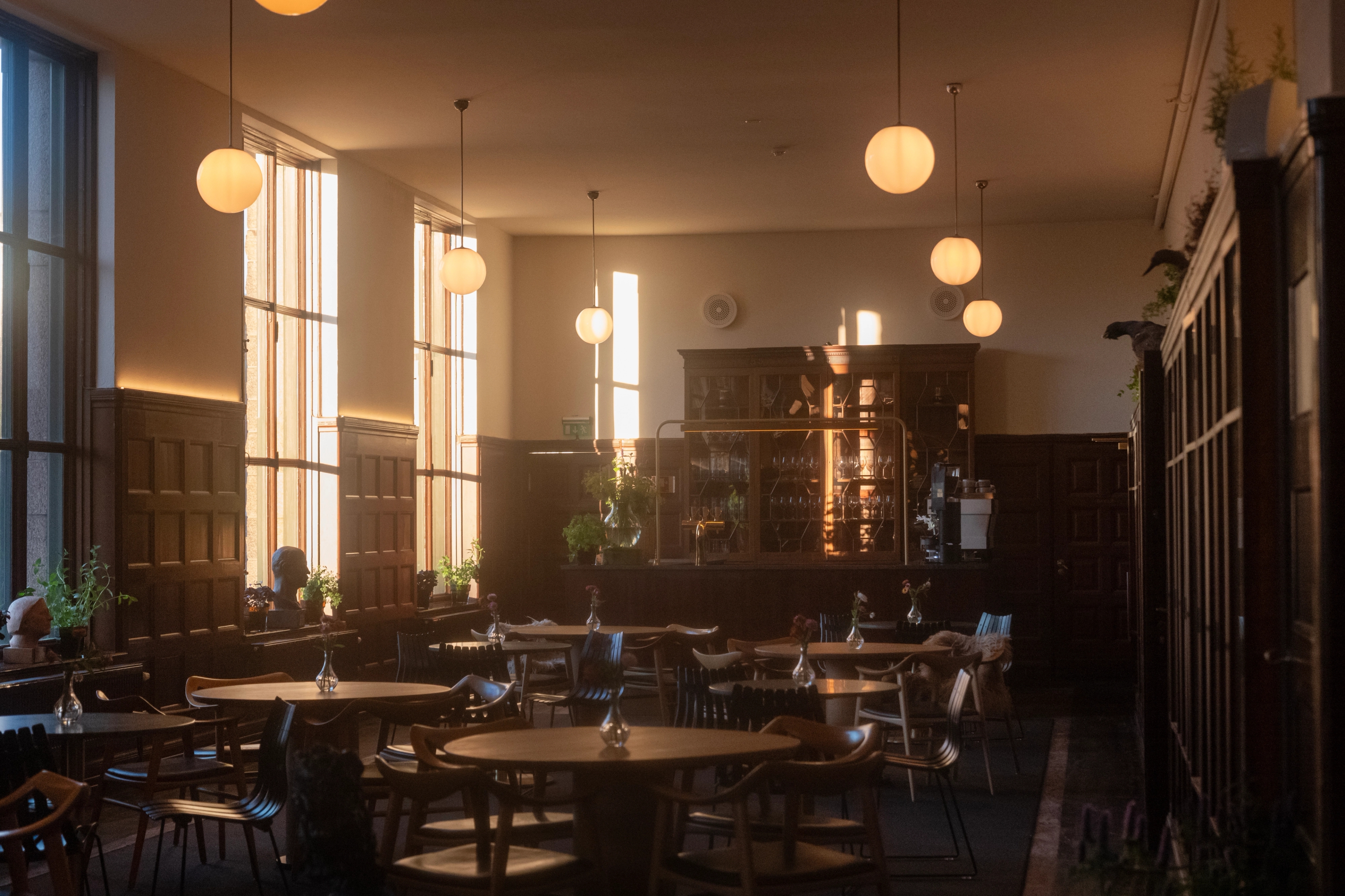 A restaurant in the National library with dark tree panels.