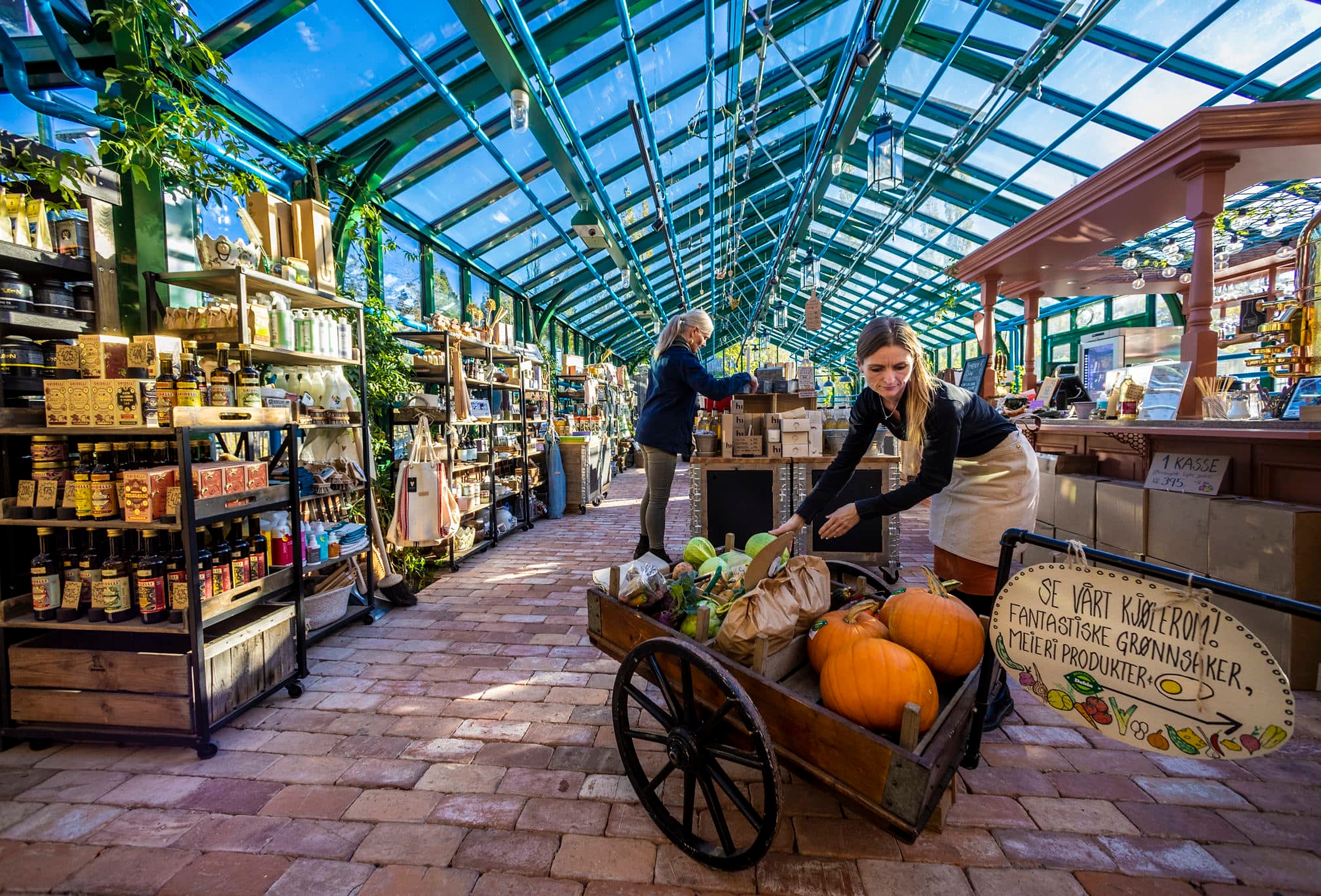 Two people in Ramme café and farm shop at The cultural destination Ramme, in Hvitsten