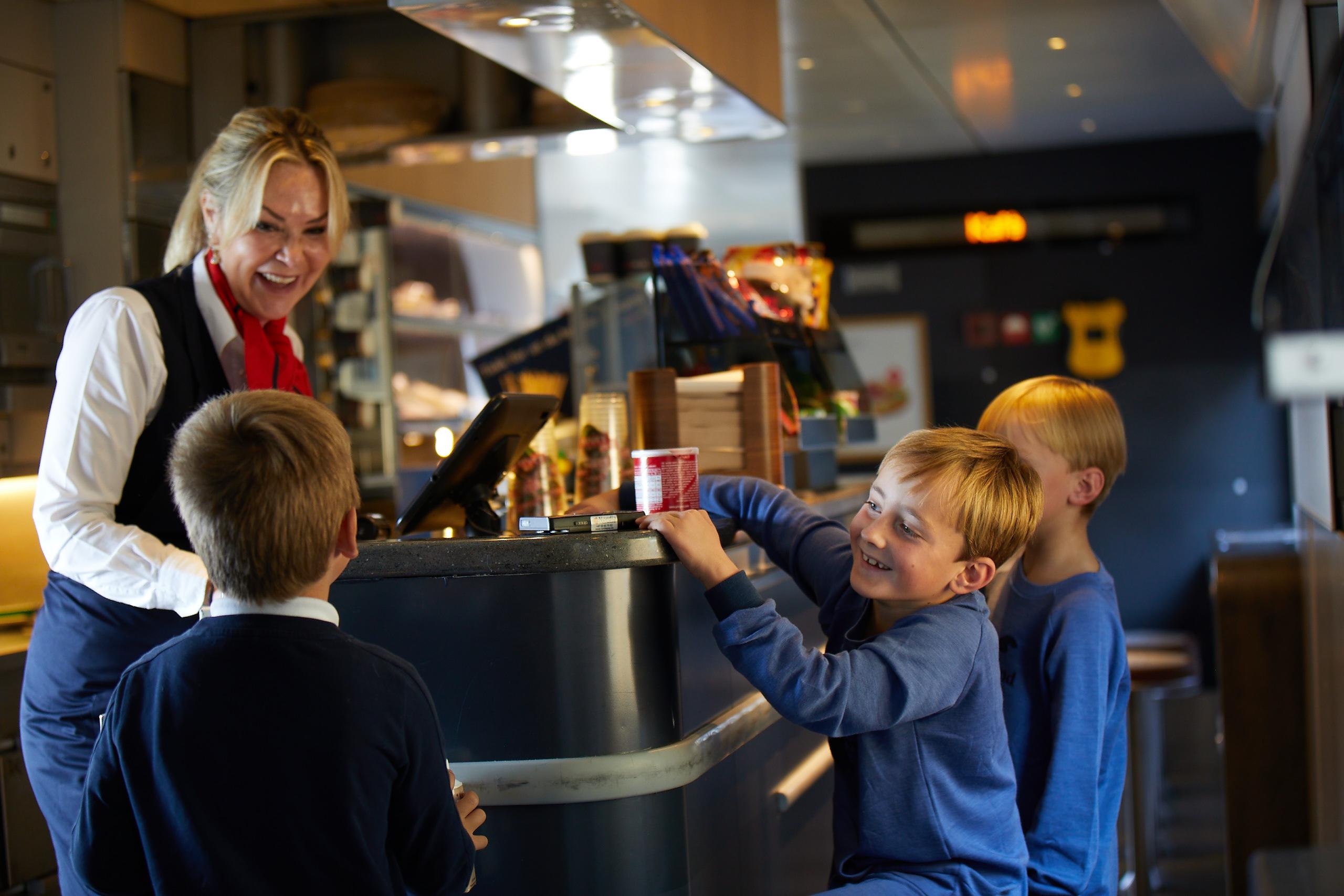 Kid in the cafe onboard a train