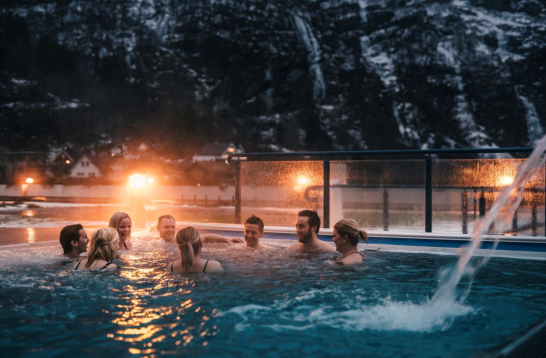 Group of people in an outdoor pool at Hotel Union Bad & Spa, Geiranger, Fjord Norway