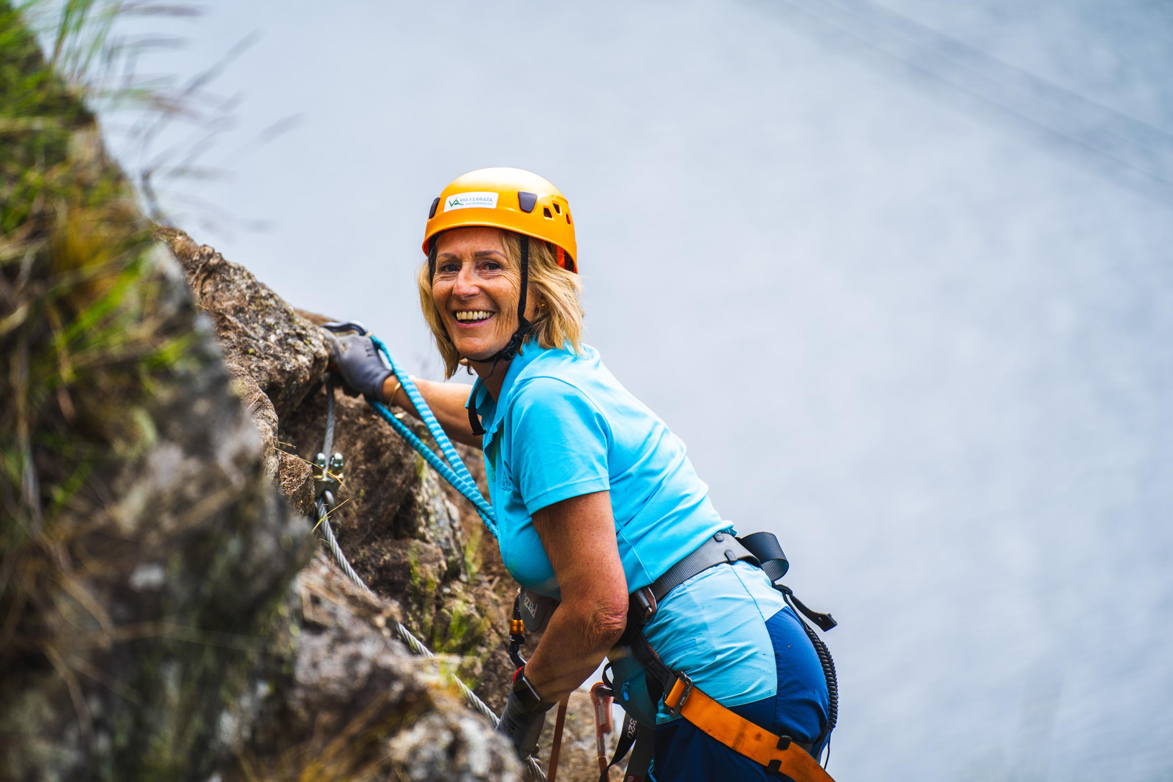 Woman climbing the Via Ferrata in Haldenkanalen