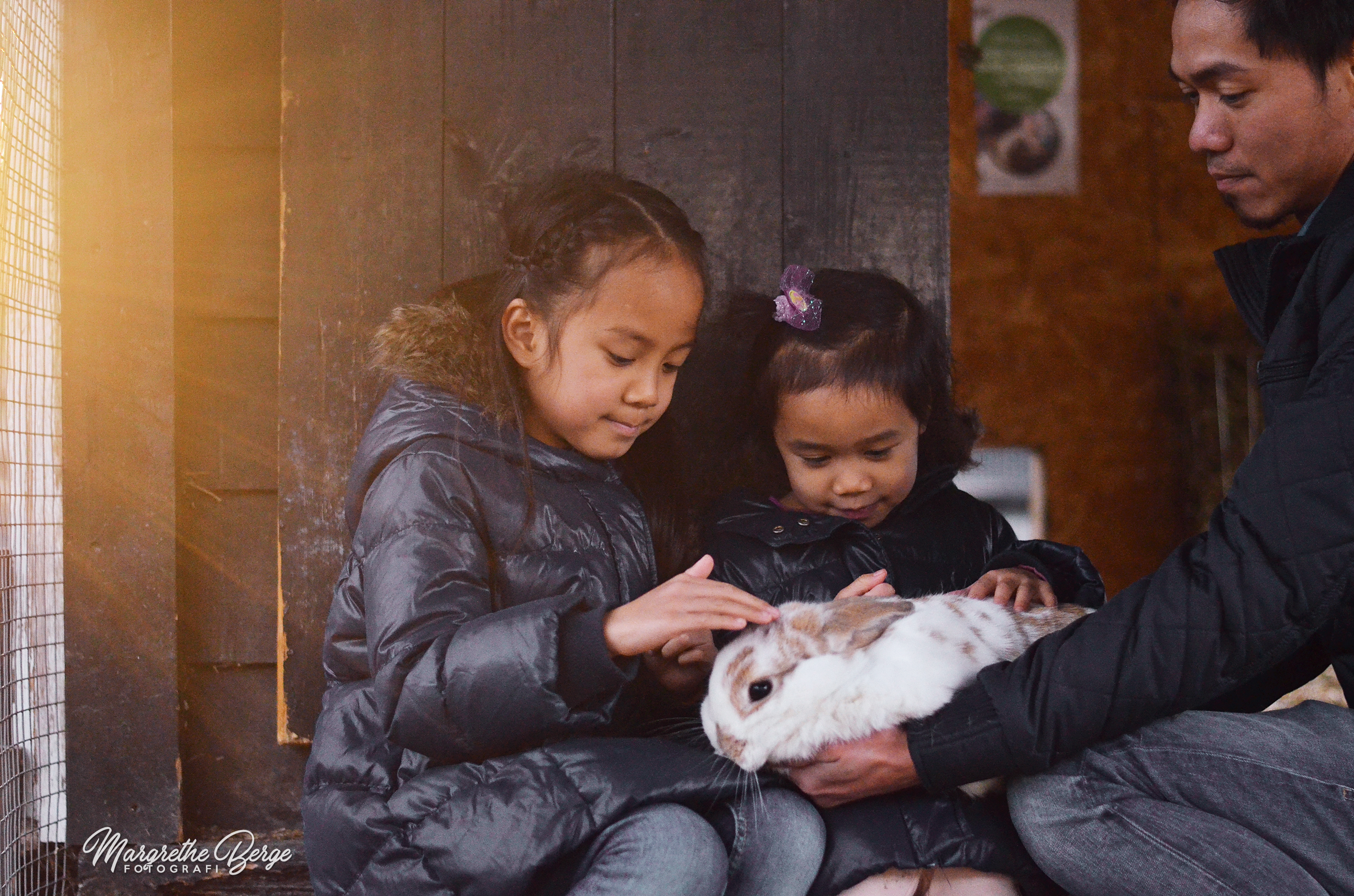 Girls petting rabbit at Ekeberg
