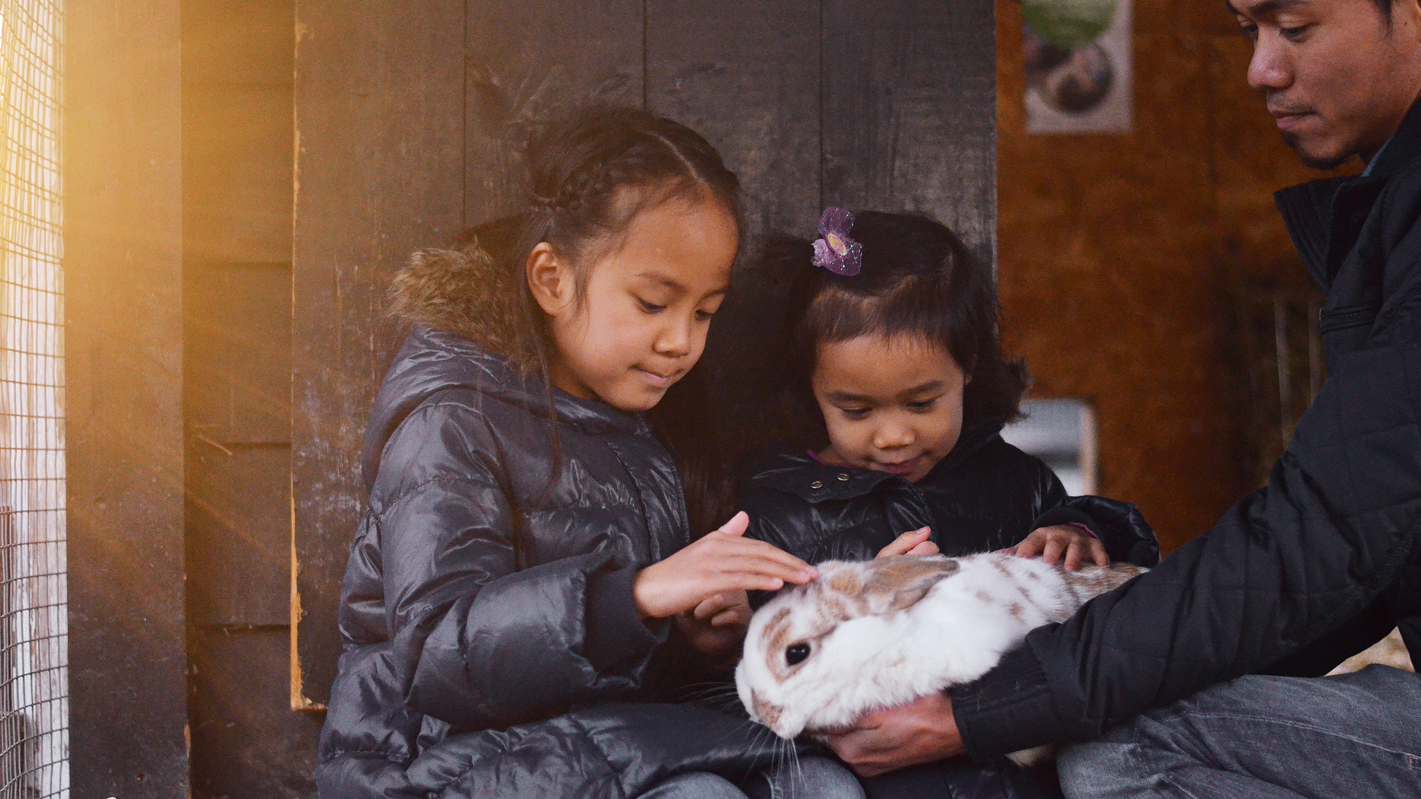 Girls petting rabbit at Ekeberg