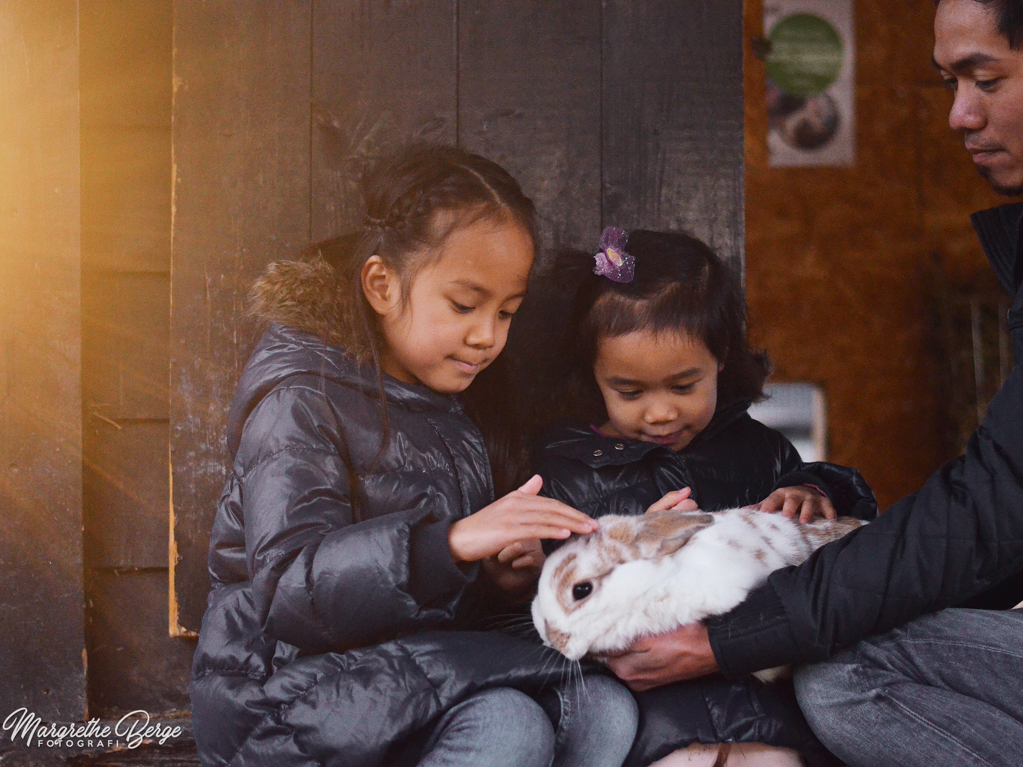 Girls petting rabbit at Ekeberg