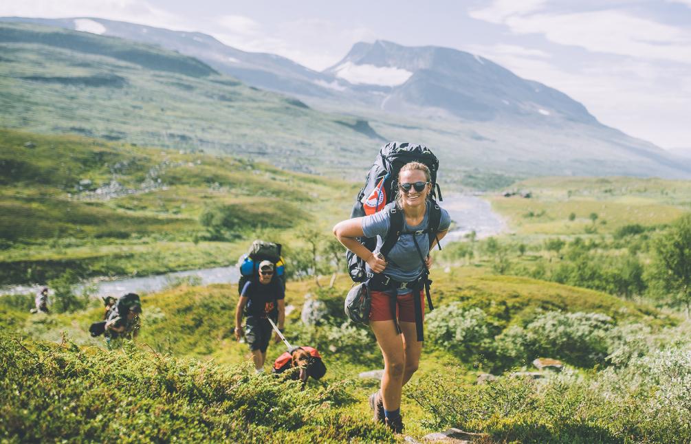 People summer hiking in mountainous landscape in Indre Troms, Northern Norway