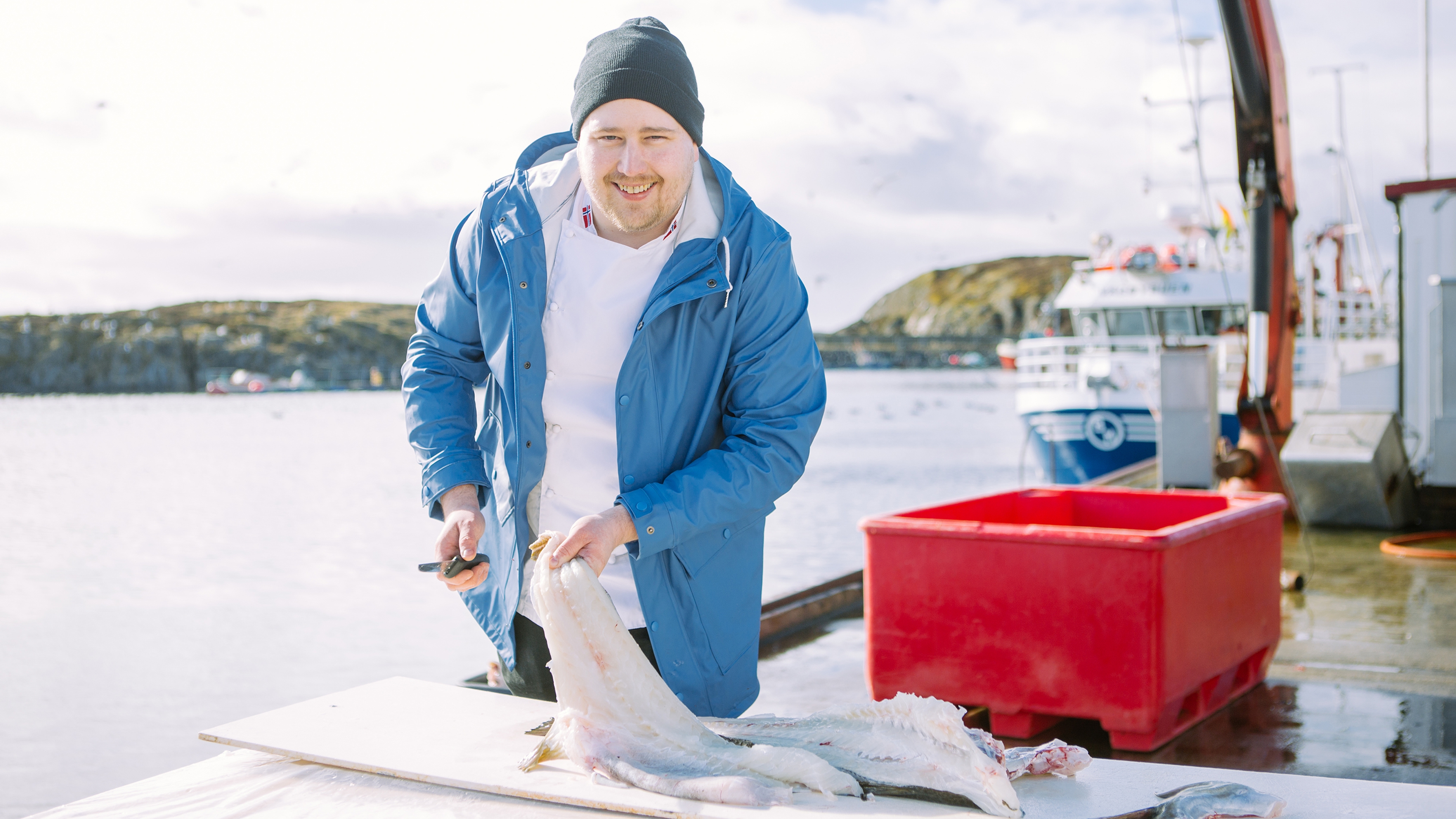 A man with a freshly caught skrei at "Skreifestivalen" festival in Rørvik