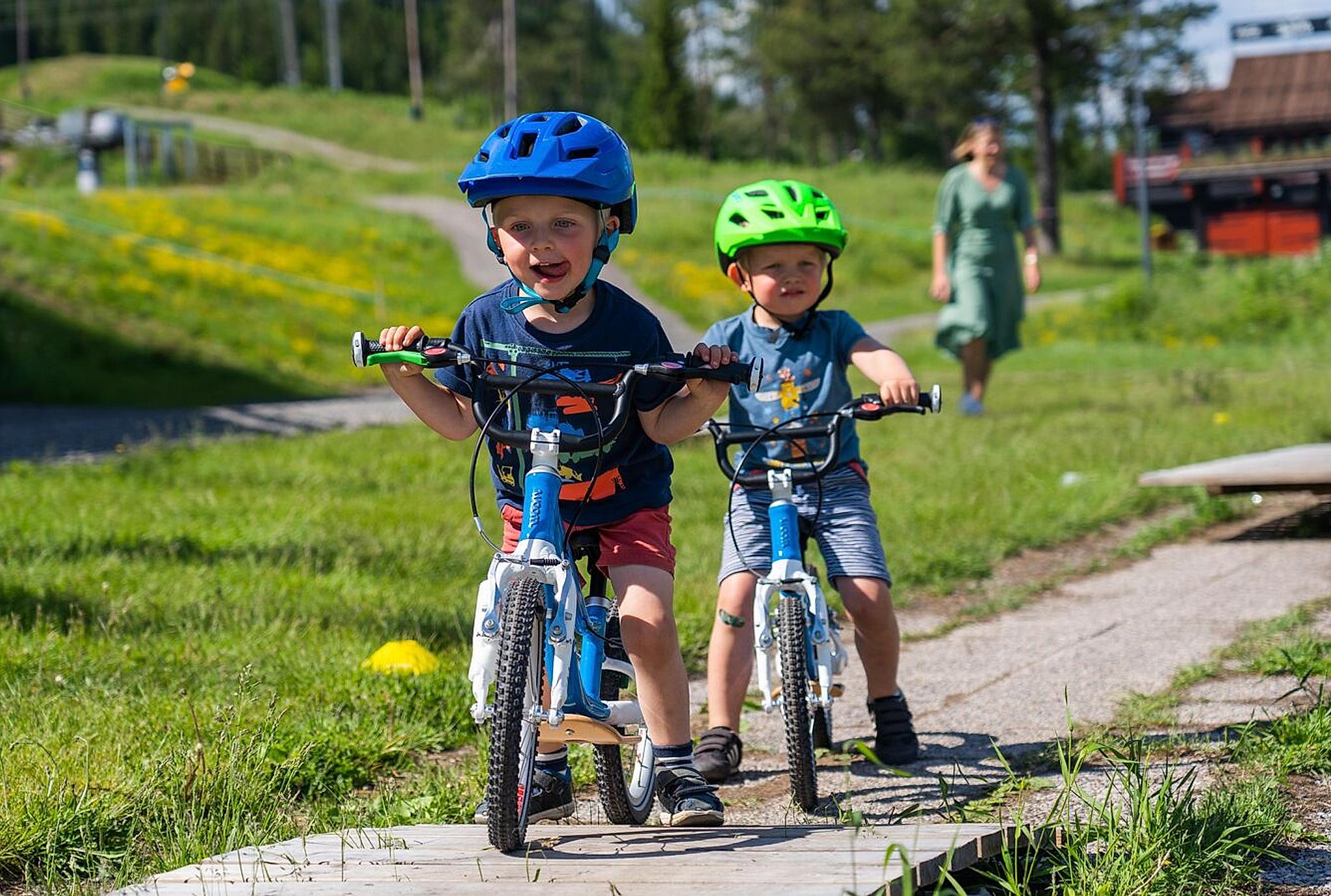 children ride bicycles in Trysil, Norway