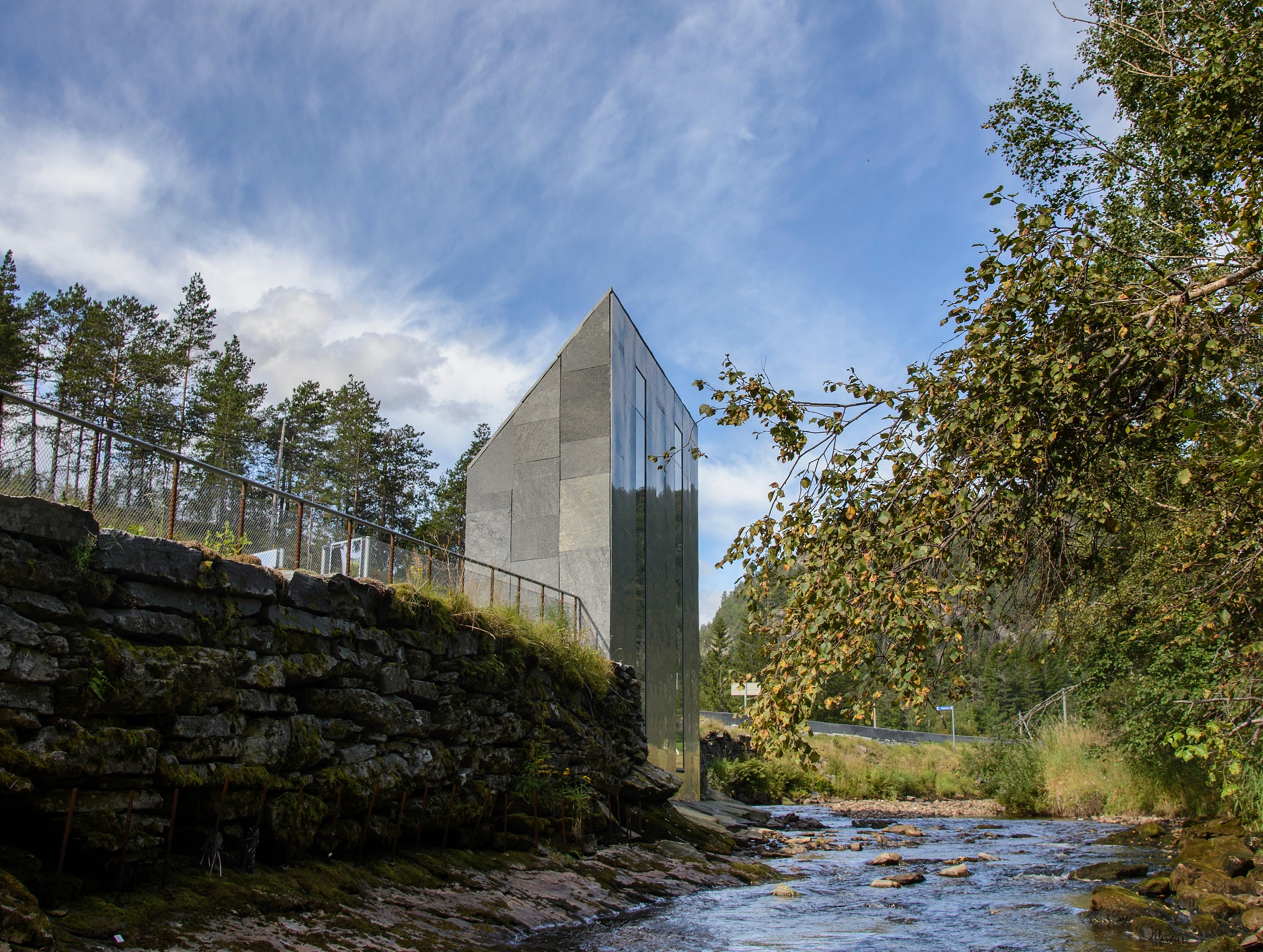 A grey architecturally designed toilet building.