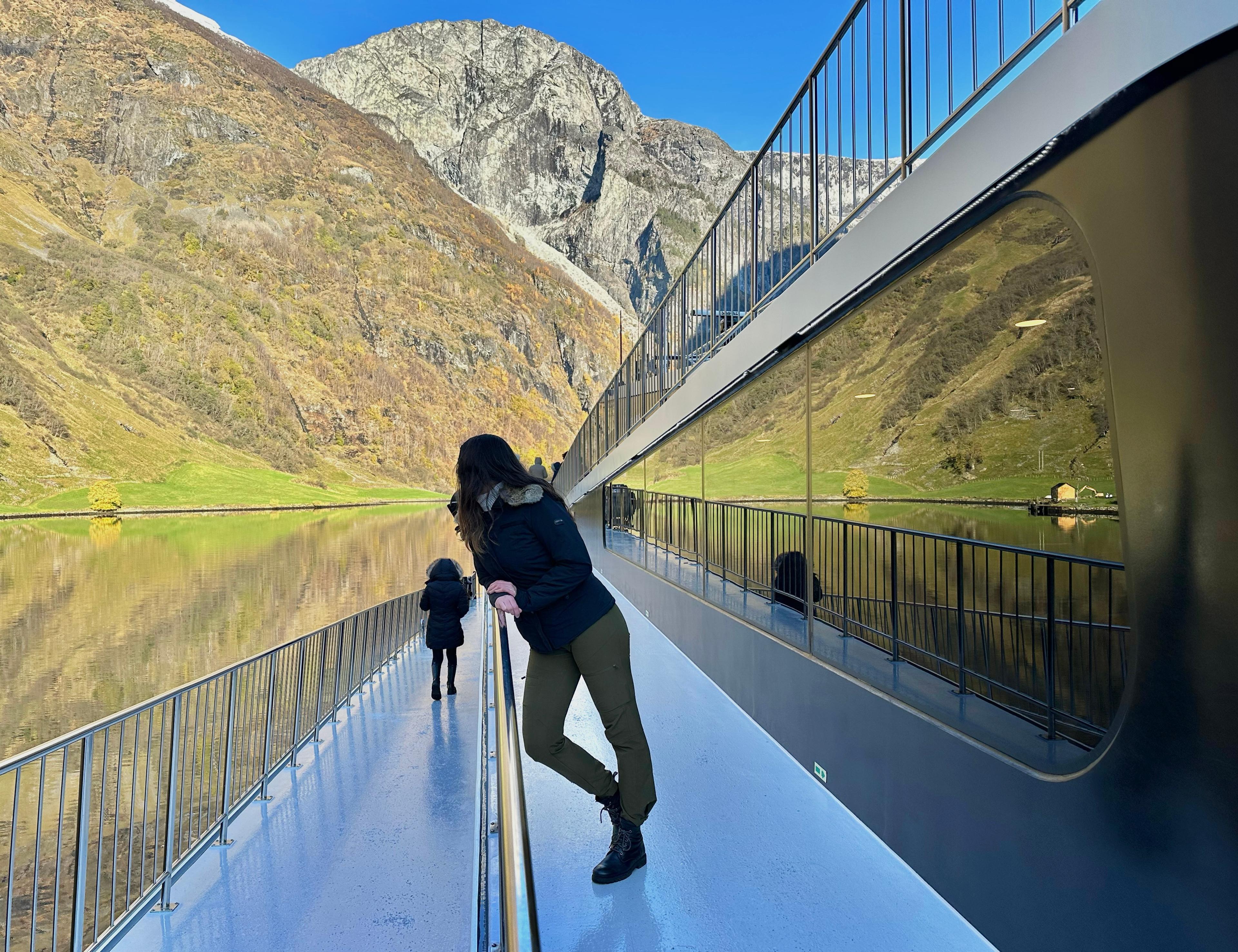 Woman at a boat in a fjord