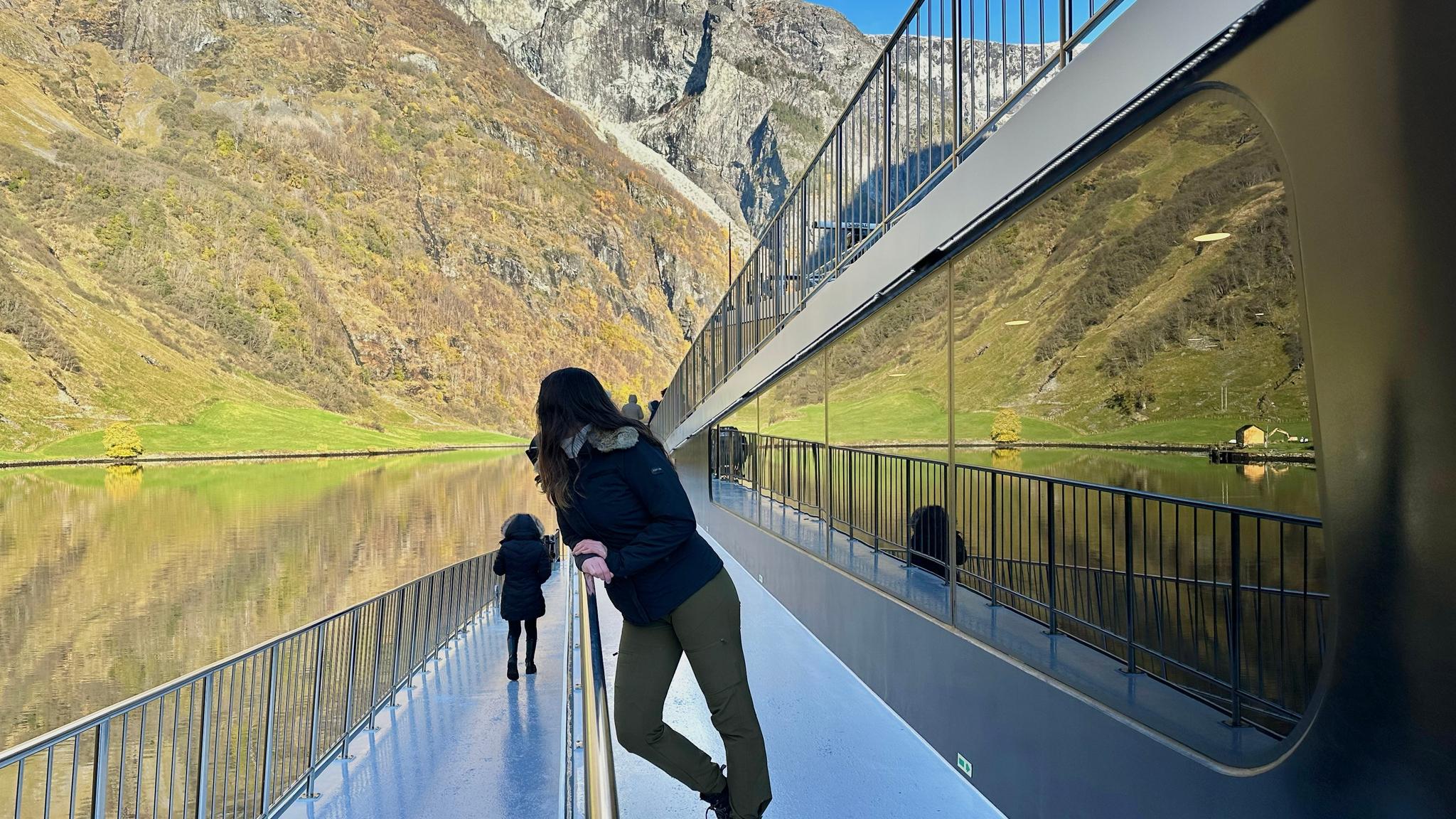 Woman at a boat in a fjord
