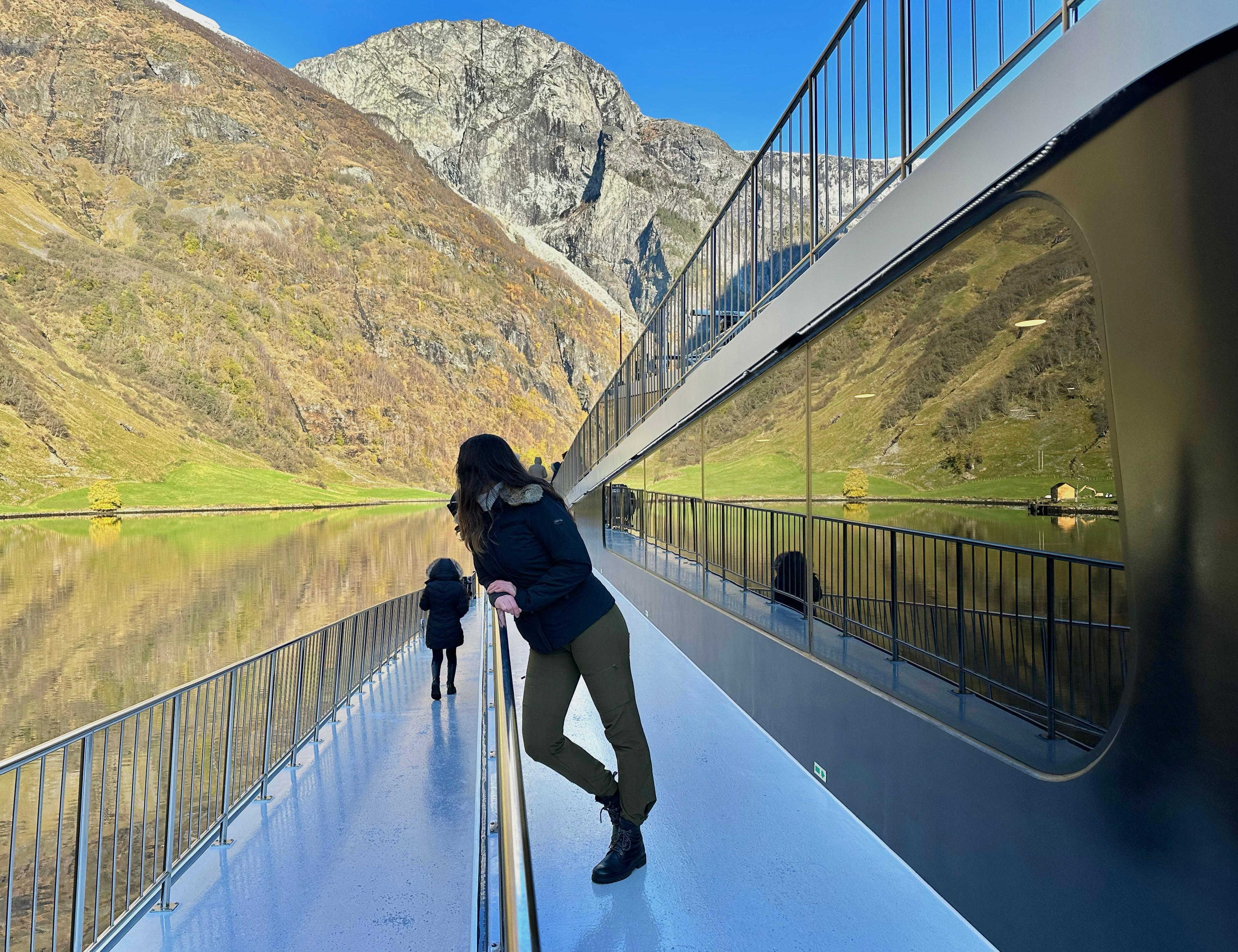 Woman at a boat in a fjord