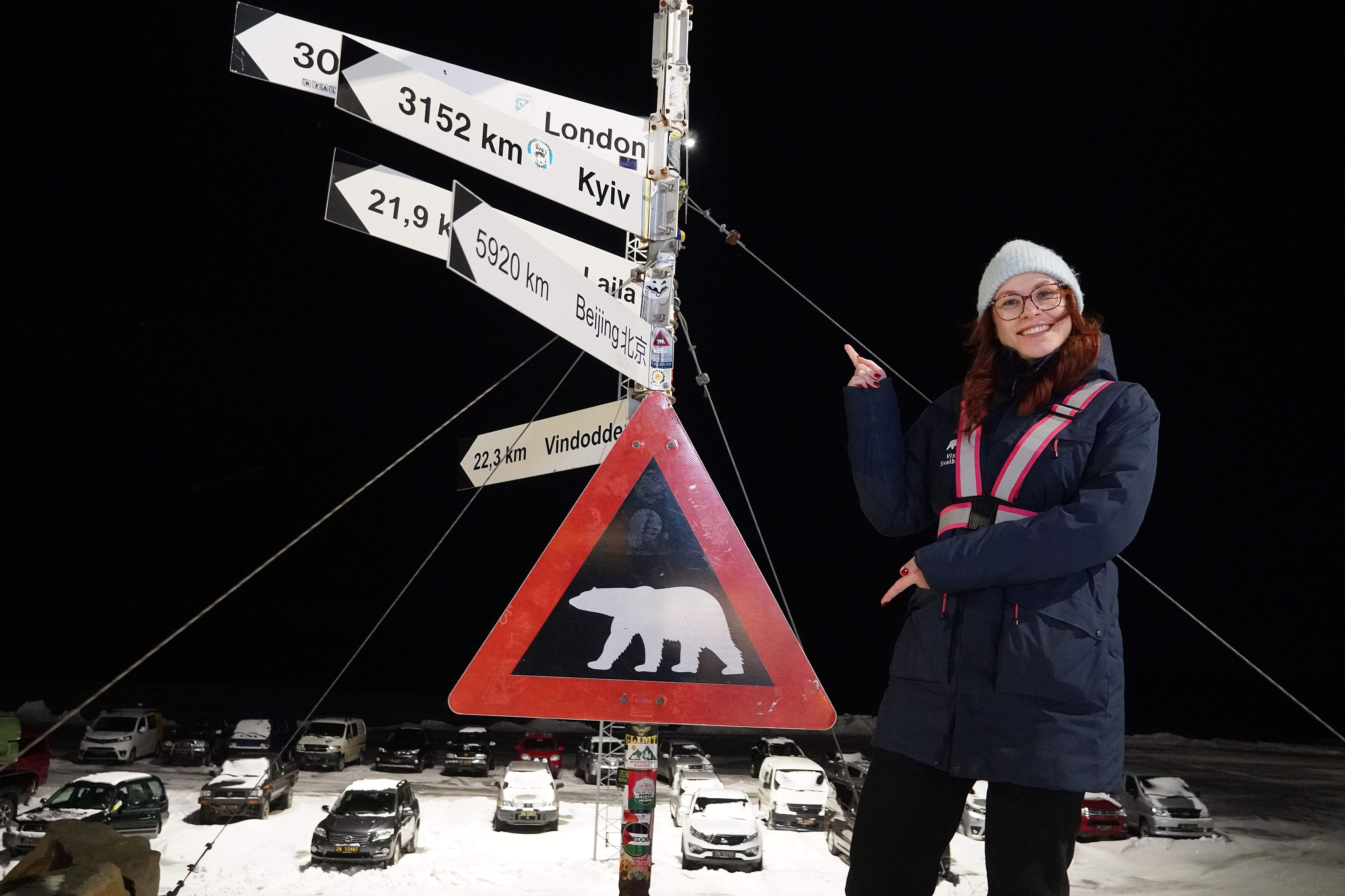 Woman in front of polar bear sign
