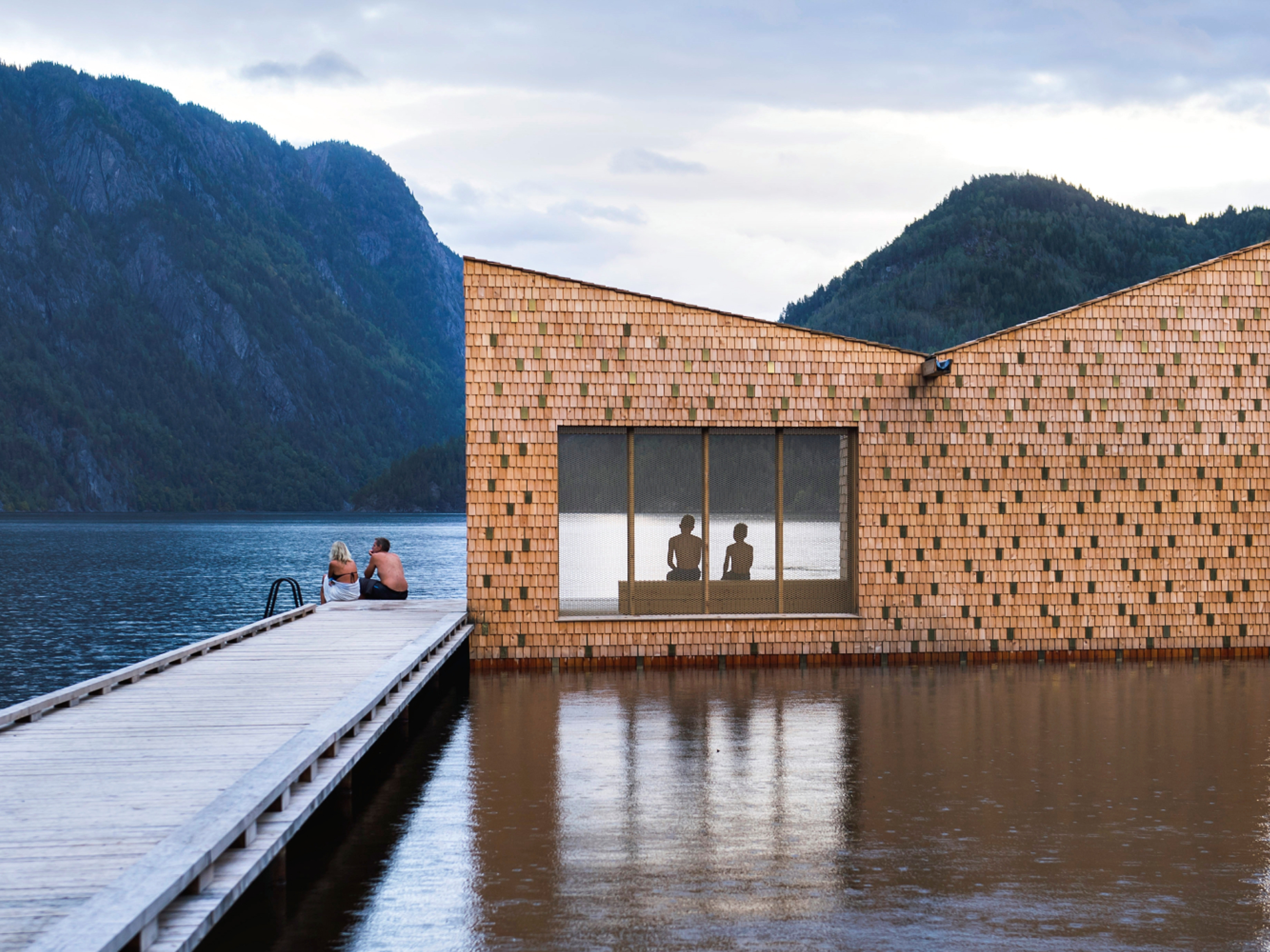 People enjoying the floating Soria Moria sauna in Telemark