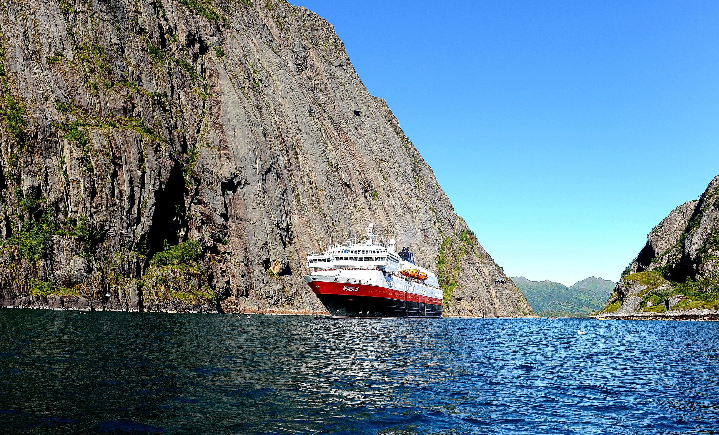 A Hurtigruten ship on the narrow Trollfjord in Northern Norway